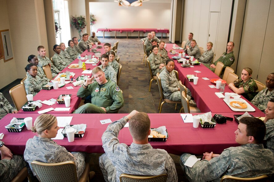 Various company grade officers from around base listen in during lunch with U.S. Air Force Col. Gary Henderson, 23rd Wing commander, at Moody Air Force Base, Ga., July 13, 2011. About 30 officers took part in the lunch to speak with the commander on topics about today’s Air Force. (U.S. Air Force photo by Staff Sgt. Jamal D. Sutter/Released)