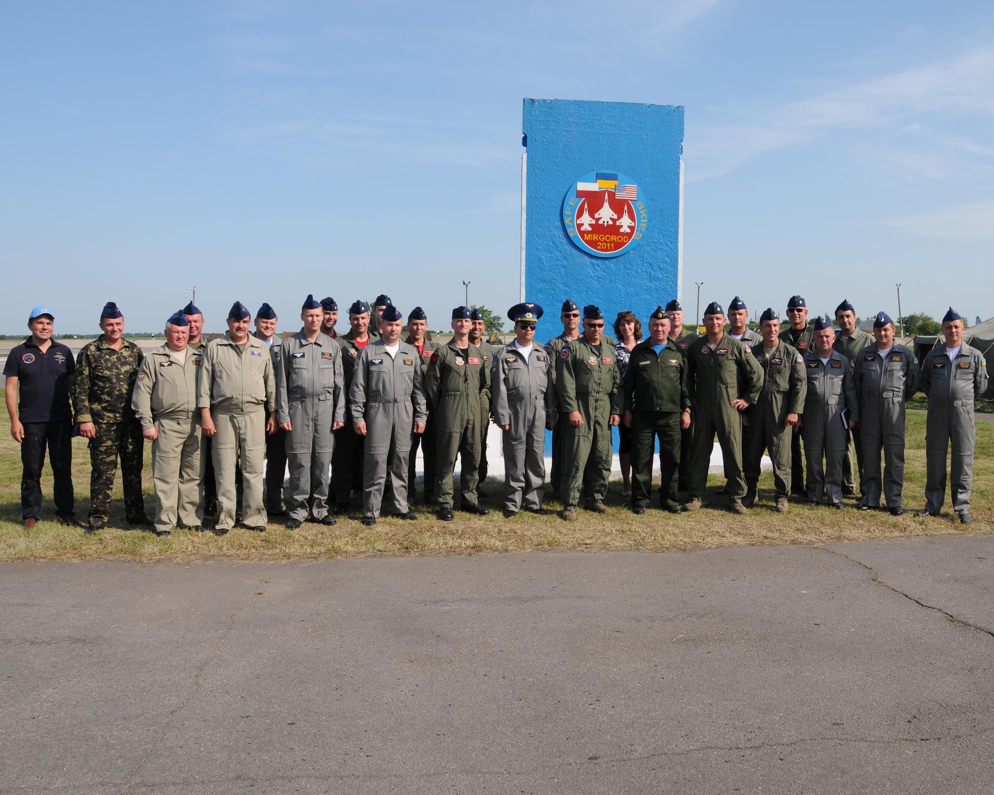 Ukrainian air force pilots at Mirgorod Air Base, Ukraine, gather with U.S. Air National Guard pilots after they shared bread, a traditional Ukrainian custom, July 16, 2011.  The U.S. pilots were there for SAFE SKIES 2011, a joint Ukraine, Poland and U.S. aerial exchange event. (U.S. Air Force photo/Tech. Sgt. Charles Vaughn)