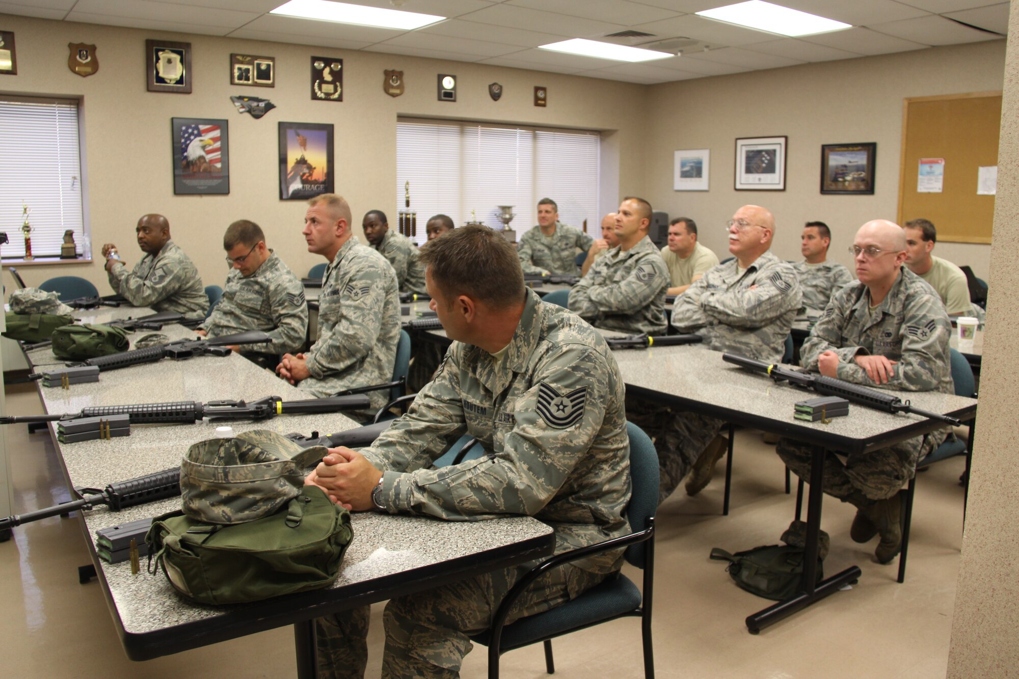Members of the 911th Airlift Wing participate in M-16 rifle training and qualification, during a unit training assembly.  Personnel are trained by Combat Arms instructors of the 911th Security Forces Squadron for both the formal training, as well as the qualification and scoring for marksmanship.  Reservists are required to qualify every three years, unless they are deploying.  (U.S. Air Force Photo/Master Sergeant Mark A. Winklosky)
