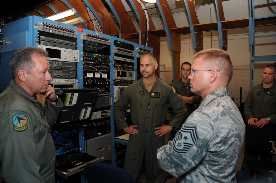 Chief Master Sgt. Michael S. Kovach, 193 Special Operations Wing explains the Partial Task Trainer to Chief Master Sgt. William W. Turner, Command Chief Master Sgt. for Air Force Special Operations Command and Chief Master Sgt. Christopher E. Muncy, Command Chief Master Sgt. for Air National Guar. The Command Chiefs came to Middletown, Pa., Saturday to meet with Airmen of the 193rd Special Operations Wing and to tour the base. (Photo by Air Force Tech. Sgt. Culeen Shaffer)