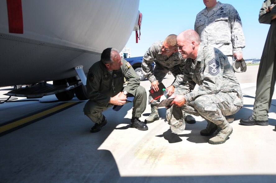 Chief Master Sgt. Michael S. Kovach, 193 Special Operations Wing explains functions of an EC-130J to Chief Master Sgt. William W. Turner, Command Chief Master Sgt. for Air Force Special Operations Command and Chief Master Sgt. Christopher E. Muncy, Command Chief Master Sgt. for Air National Guard. The Command Chiefs came to Middletown, Pa., Saturday to meet with Airmen of the 193rd Special Operations Wing and to tour the base. (Photo by Air Force Tech. Sgt. Culeen Shaffer)