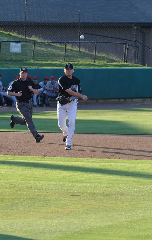 A Bowie Baysox player throws a runner out at first during the Andrews Night at the Bowie Baysox July 15.  The Baysox held an appreciation night for Team Andrews members and their families. (U.S. Air Force Photo by Senior Airman Torey Griffith)