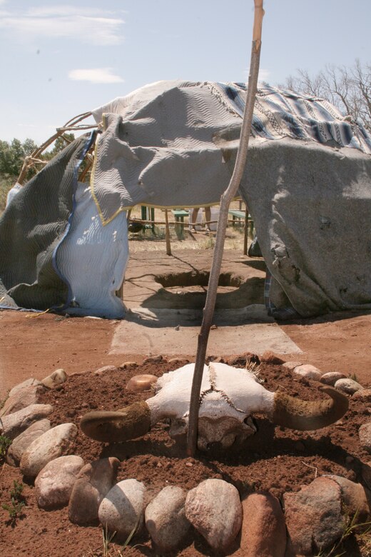 A buffalo skull sits on an altar facing the entrance of the Lakota Sioux sweat lodge. Buffaloes are believed to be creatures to emulate because they are known to sacrifice themselves for their family. (Army photo/Samantha Koss)
