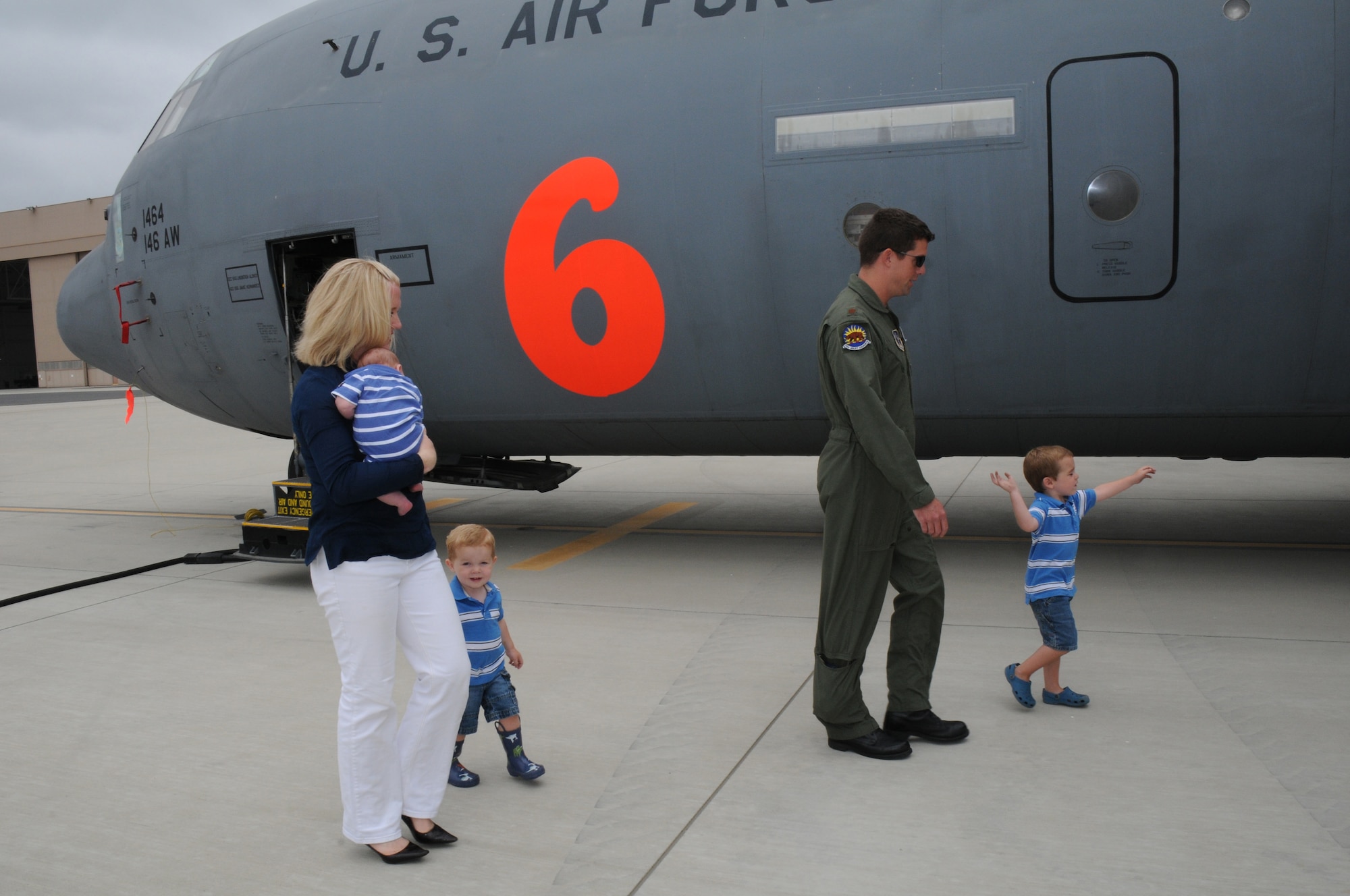 Megan Glynn, named the 2011 Air Force Spouse of the Year in an award program sponsored by Military Spouse magazine, walks with her husband, Maj. Matt Glynn, and their three boys, Cooper, Murphy and JP, July 13, 2011.  Her husband is a C-130J Super Hercules pilot with the California Air National Guard’s 146 Airlift Wing at Channel Islands ANG Station near Oxnard, Calif.  (U.S. Air Force photo)