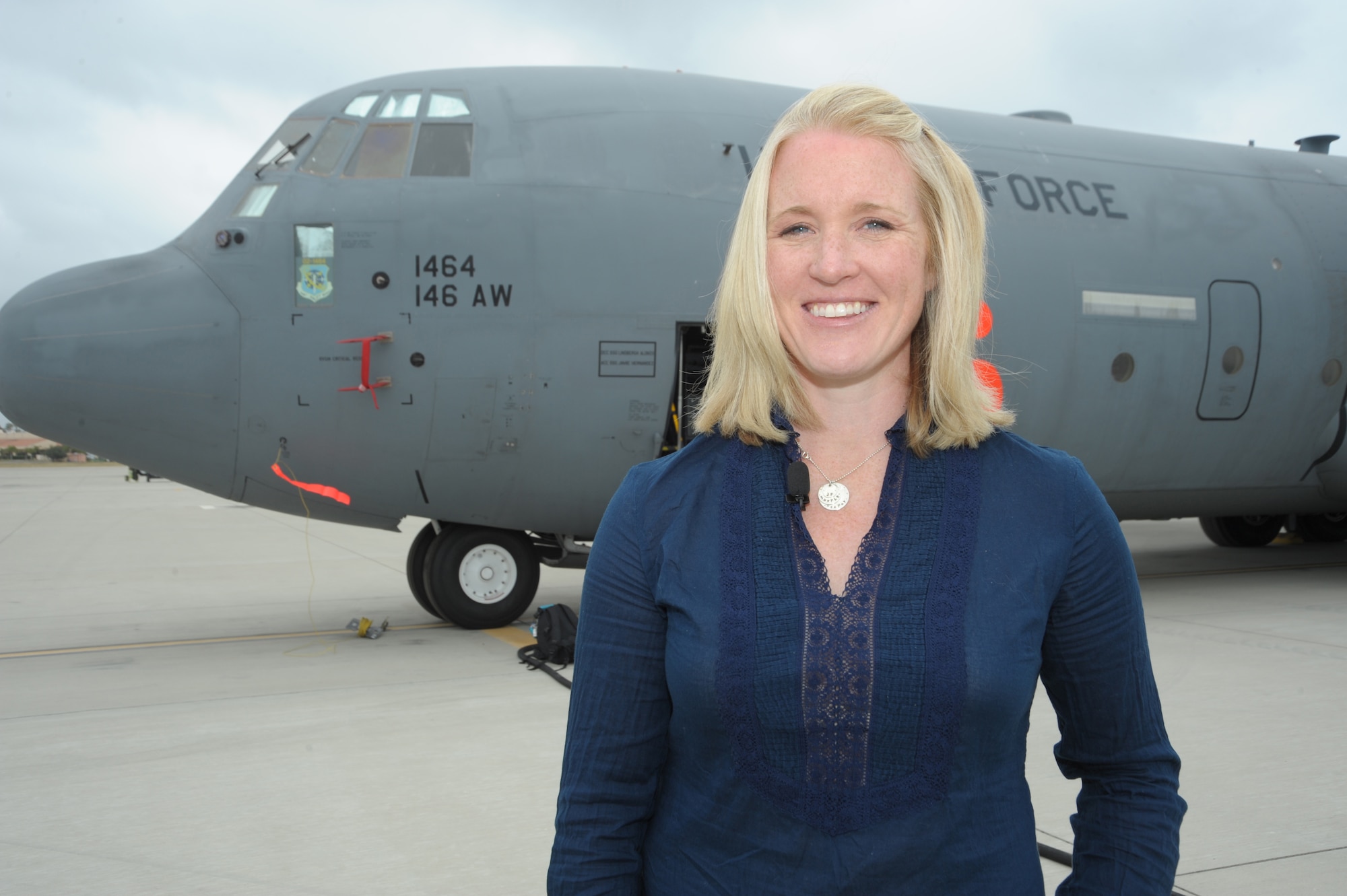 Megan Glynn, standing in front of a C-130J Super Hercules July 13, 2011, was named 2011 Air Force Spouse of the Year in an award program sponsored by Military Spouse magazine.  Her husband, Maj. Matt Glynn, is a C-130J pilot with the California Air National Guard’s 146 Airlift Wing at Channel Islands ANG Station near Oxnard, Calif.  (U.S. Air Force photo)