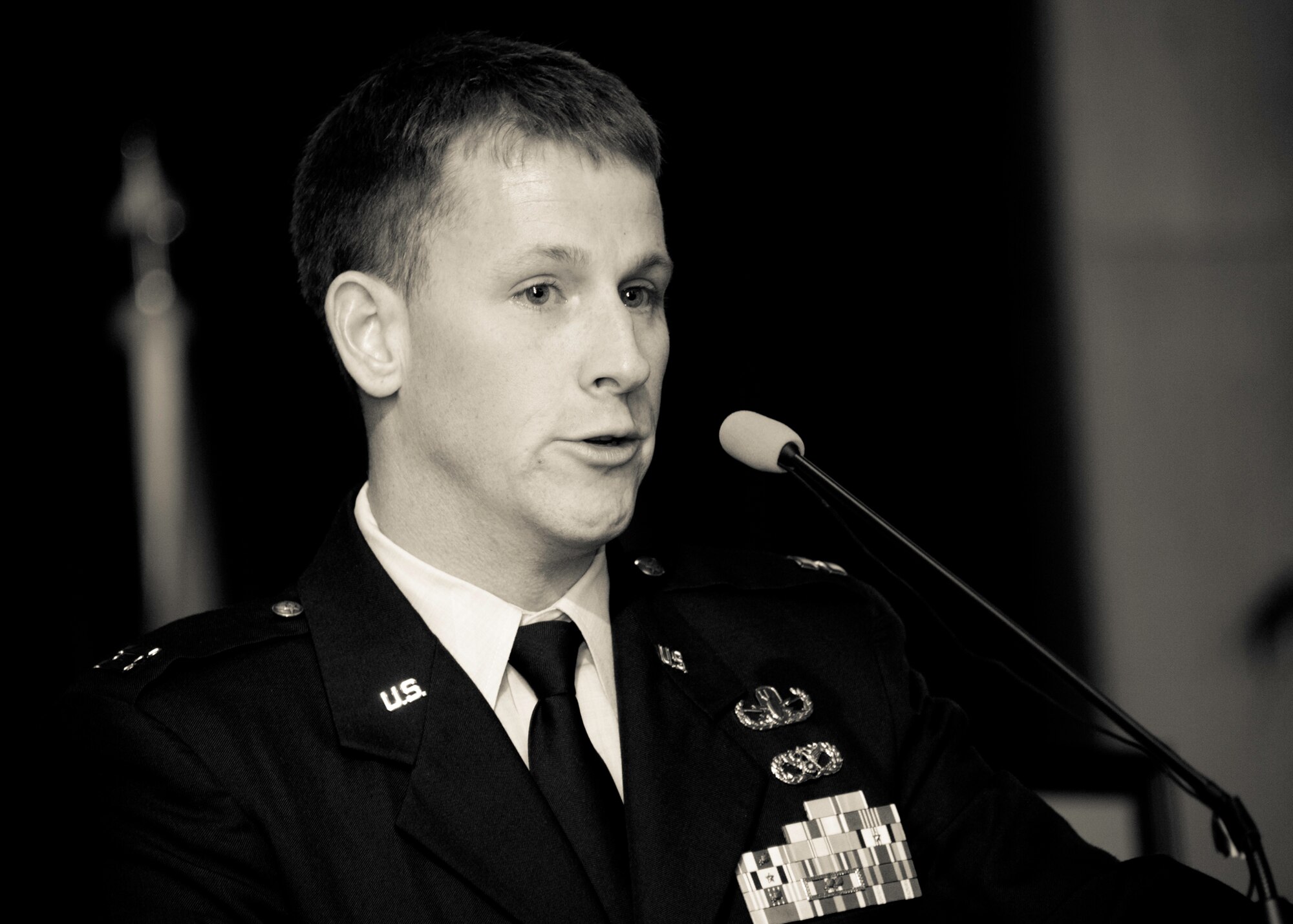 Capt. Jonathan Herman, the 96th Explosive Ordnance Disposal Flight commander, speaks to a crowd of more than 300 people at a memorial ceremony for Tech. Sgt. Daniel Douville at Eglin Air Force Base, July 14.  Douville, an explosive ordnance disposal technician with the 96th Civil Engineer Squadron, died June 26 as a result of injuries suffered from an improvised explosive device in Afghanistan.  Friends, family and the local community turned out to remember and praise his contributions to his country.  (U.S. Air Force photo/Samuel King Jr.)