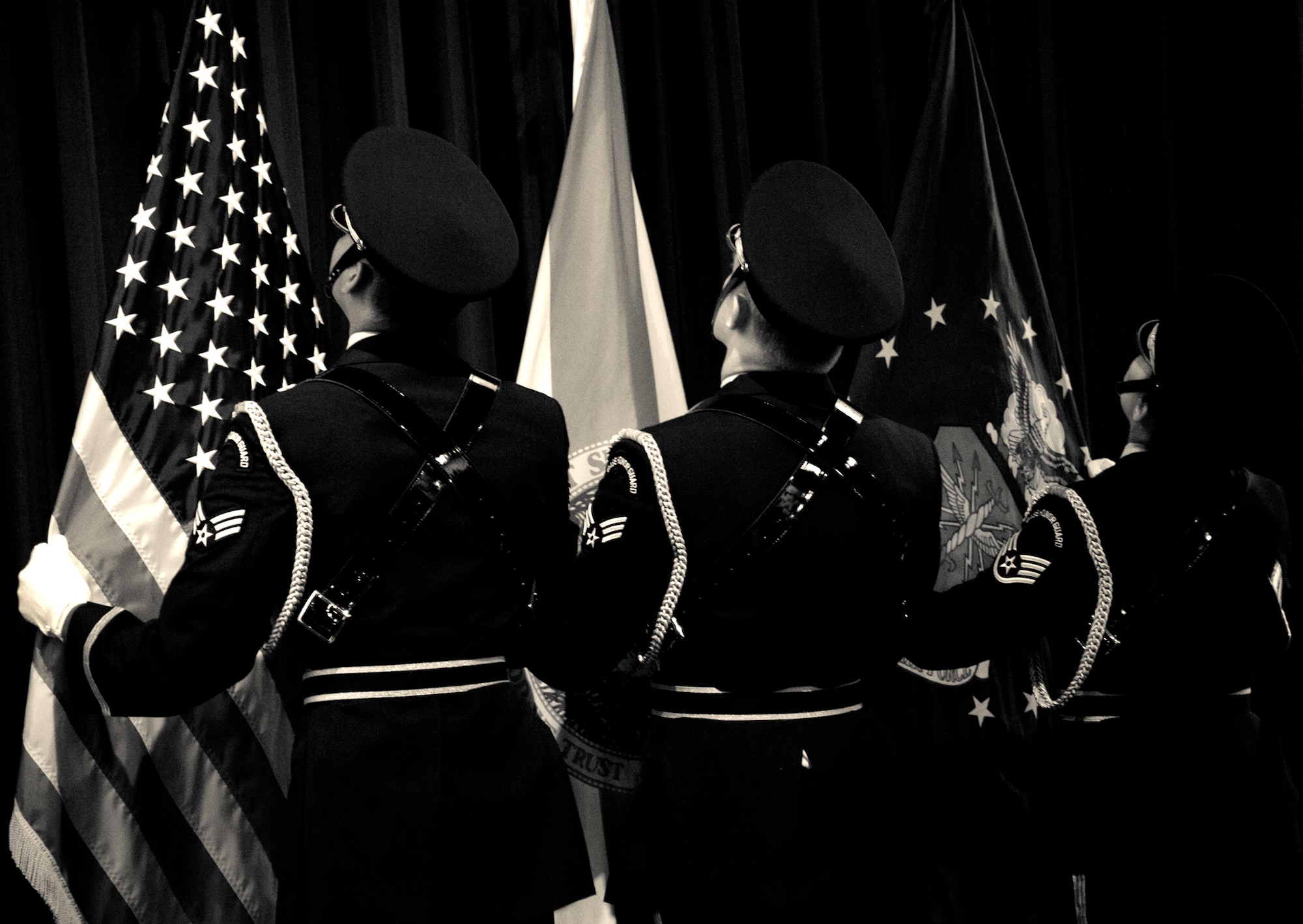 Eglin’s honor guard post the colors at the beginning of the memorial ceremony honoring Tech. Sgt. Daniel Douville, an explosive ordnance disposal technician with the 96th Civil Engineer Squadron, at Eglin Air Force Base, July 14.  Douville died June 26, as a result of injuries suffered from an improvised explosive device in Afghanistan.  Friends, family and the local community turned out to remember and praise his contributions to his country.  (U.S. Air Force photo/Samuel King Jr.)