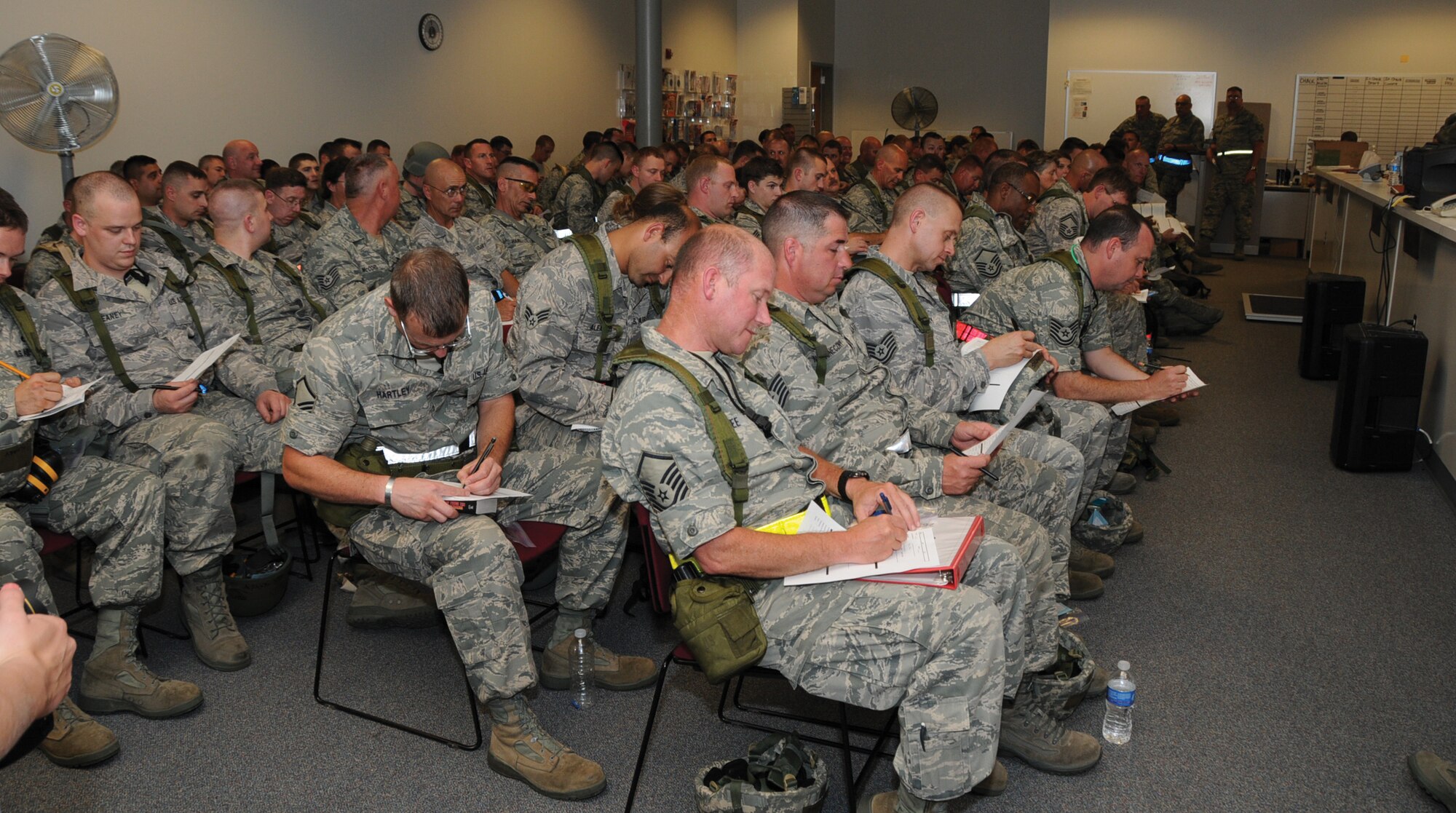 Reservists wait in the wing assembly area after processing for "deployment," June 4, during the phase-one operational readiness exercise. The inspection, scheduled for August, will test the wing's ability to deploy. The 442nd SFS is part of the 442nd Fighter Wing, an A-10 Thunderbolt II Air Force Reserve unit at Whiteman Air Force Base, Mo. (U.S. Air Force photo/Staff Sgt. Danielle Wolf)