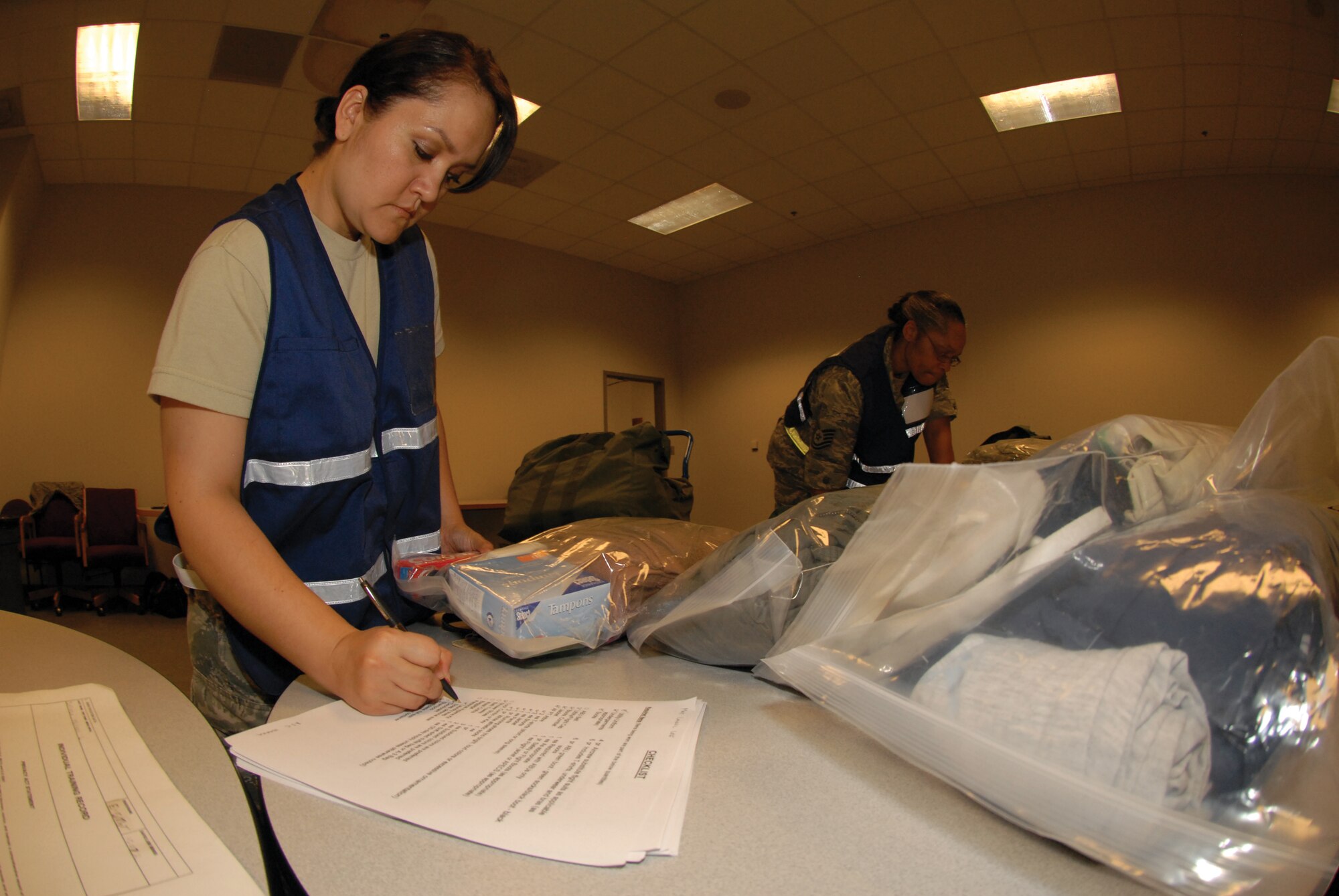 Airman 1st Class Dianna Ibarra, 442nd Force Support Squadron, inspects mobility bags, June 4 during the phase-one operational readiness exercise. The inspection, scheduled for August, will test the wing's ability to deploy. The 442nd SFS is part of the 442nd Fighter Wing, an A-10 Thunderbolt II Air Force Reserve unit at Whiteman Air Force Base, Mo. (U.S. Air Force photo/Staff Sgt. Danielle Wolf)