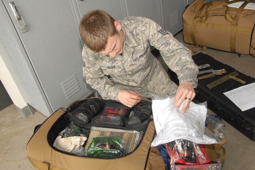 Staff Sgt. John Yutz, 442nd Civil Engineers Squadron, inspects his mobility bag, June 2, 2011. Sergeant Yutz and approximately 35 other reservists are scheduled to deploy August 2011. The 442nd CES is part of the 442nd Fighter Wing, an A-10 Thunderbolt II Air Force Reserve unit, Whiteman Air Force Base, Mo. (U.S. Air Force photo/Senior Airman Wesley Wright)