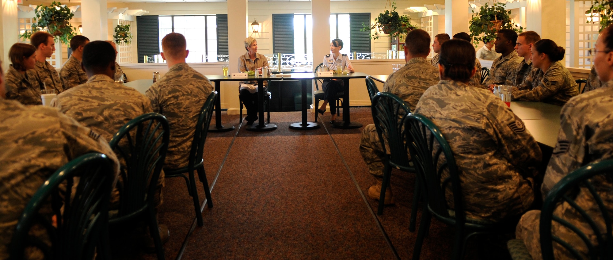 Dr. Jo Ann Rooney, Principal Under Secretary of Defense for Personnel and Readiness, addresses Airmen during lunch at Langley Air Force Base, Va., July 12, 2011. Dr. Rooney visited multiple units during her visit in order to better understand the overall mission and impact of Joint Base Langley-Eustis. (U.S. Air Force photo by Staff Sgt. Dana Hill/Released)