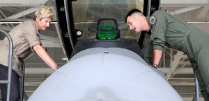 Dr. Jo Ann Rooney, Principal Under Secretary of Defense for Personnel and Readiness, receives a mission brief and tour of the F-22 Raptor from Lt. Col. Peter Fesler, 27th Fighter Squadron commander, during a visit to Langley Air Force Base, Va., July 12, 2011. Dr. Rooney visited multiple units during her visit in order to better understand the overall mission and impact of Joint Base Langley-Eustis. (U.S. Air Force photo by Staff Sgt. Dana Hill/Released)