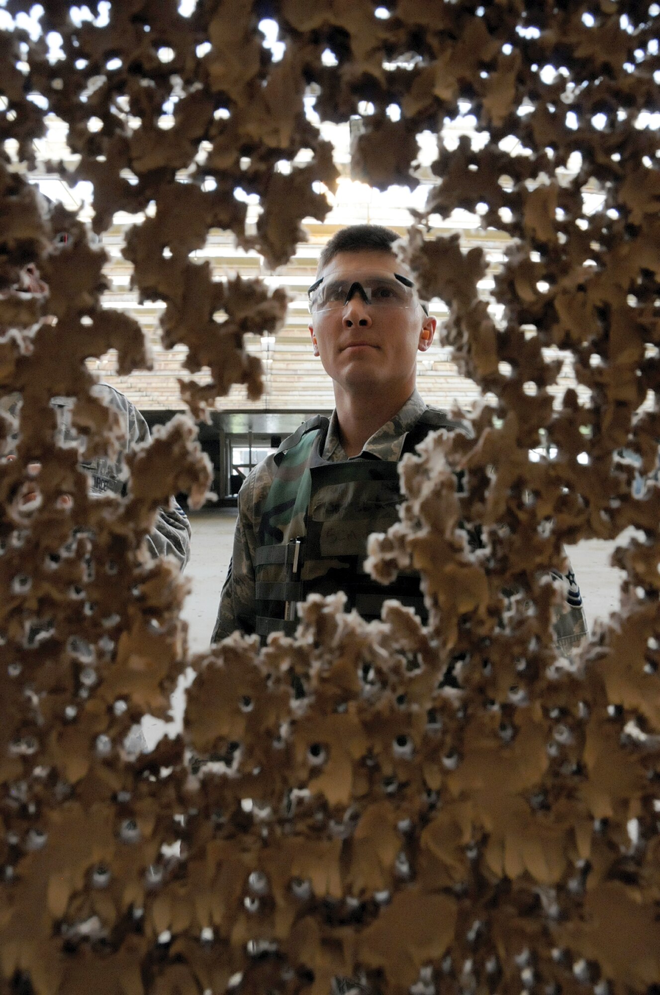 Master Sgt. Denver Long, noncommissioned officer in charge of the 442nd Civil Engineers Structures Shop, reviews his target during M-4 qualification, June 3. Sergeant Long is scheduled to deploy August 2011 with approximately 35 CES reservists. The 442nd CES is part of the 442nd Fighter Wing, an A-10 Thunderbolt II Air Force Reserve unit, Whiteman Air Force Base, Mo. (U.S. Air Force photo/ Tech. Sgt. Kent Kagarise)
