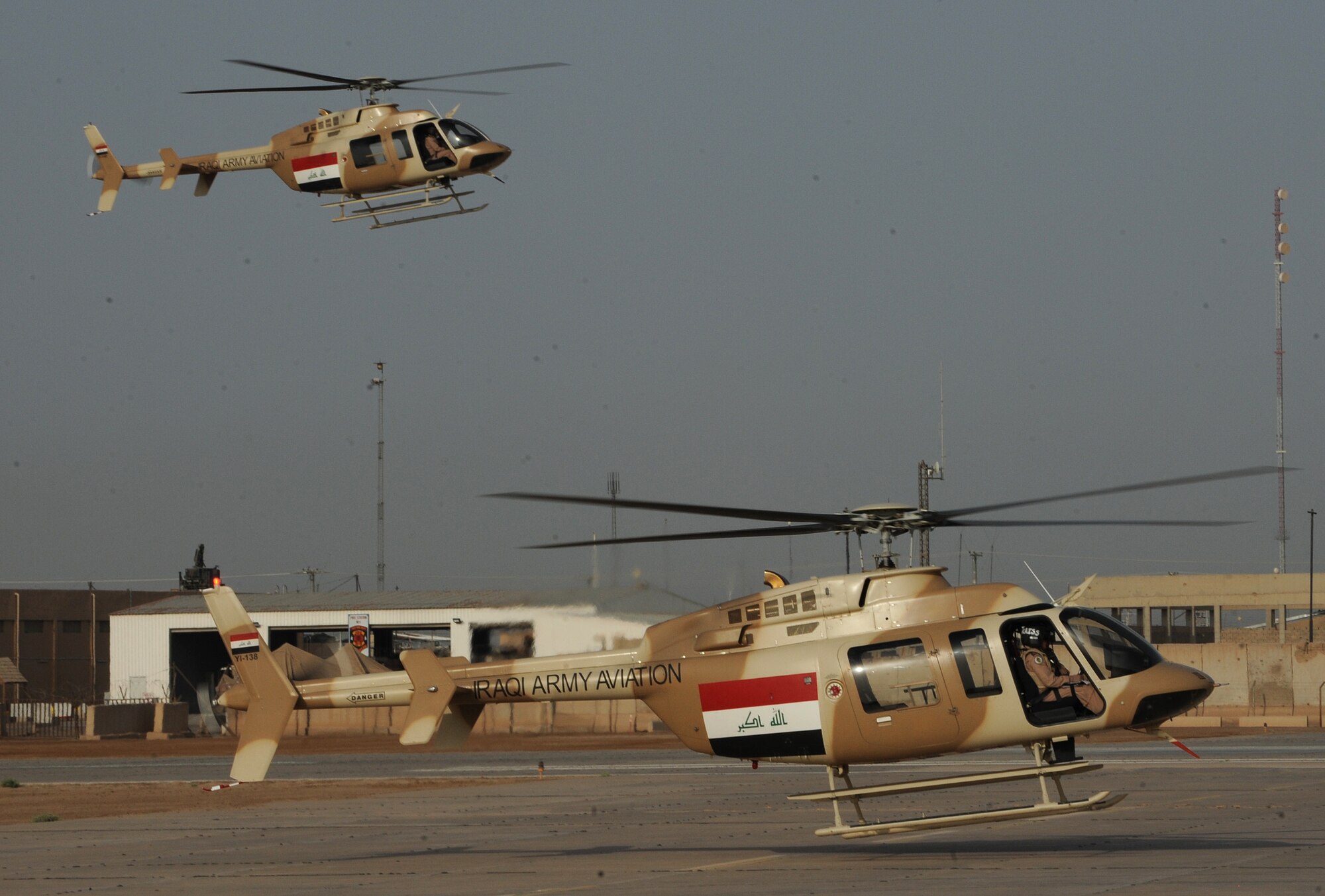Iraqi Army Aviation Command, Squadron 21, Bell 407 helicopters fly at Taji Air Base, Iraq, July 14, 2011. Assigned to Taji Air Base, the 721st Air Expeditionary Advisory Squadron trains, advises and assists Iraqi pilots and maintenance personnel, focusing on sustainability, reliability and interoperability. (U.S. Air Force photo/Staff Sgt. Mike Meares)







