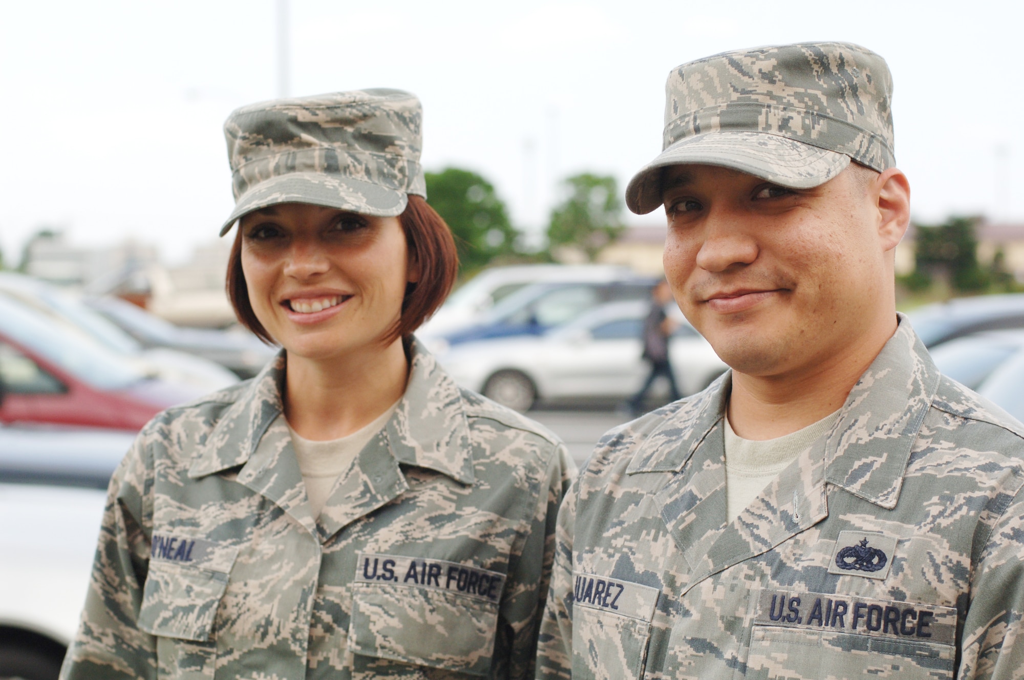 YOKOTA AIR BASE, Japan – Tech Sgt. Sherrill O’Neal (left) and Staff Sgt. Aaron Juarez, 374th Force Support Squadron Airman Leadership School instructors, pose for a photo recently at Yokota Air Base, Japan. Sergeant O’Neal said she helps conserve energy by using the stairs instead of the escalator. Sergeant Juarez said he helps ensure that all of the lights are off in the ALS building when they aren’t in use. (U.S. Air Force photo/Airman 1st Class Katrina R. Menchaca)