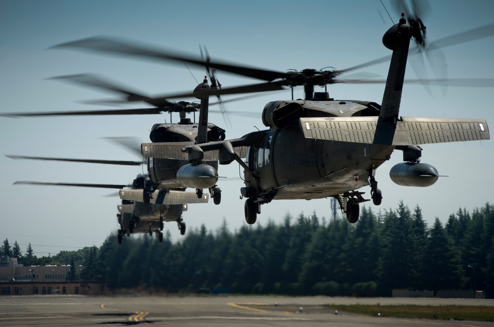 Four U.S. Army UH-60 Blackhawk helicopters lift off from Yokota Air Base, Japan, carrying U.S. Navy Adm. Mike Mullen, Chairman of the Joint Chiefs of Staff, July 15, 2011. (U.S. Air Force photo/Staff Sgt. Samuel Morse)