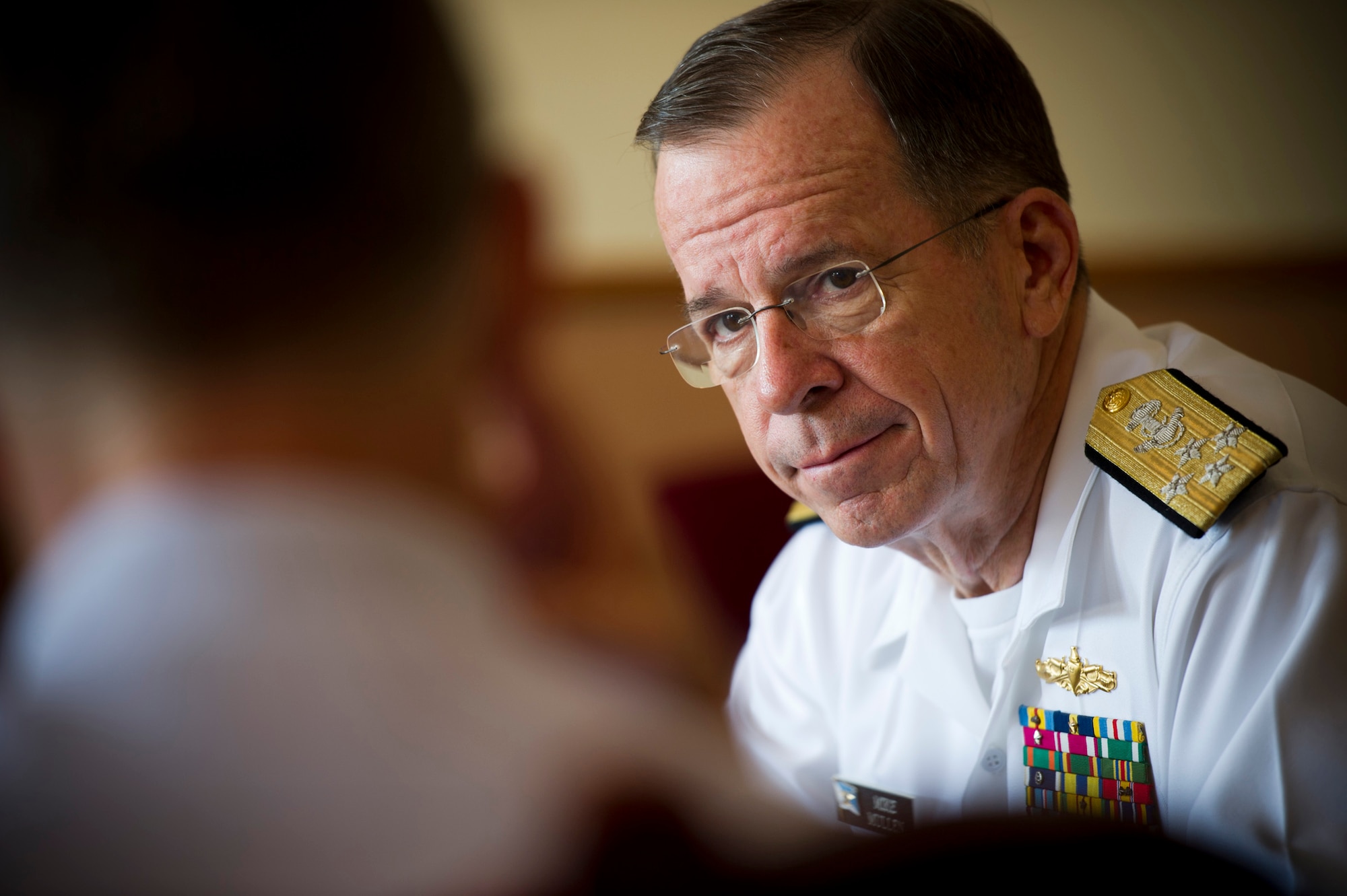U.S. Navy Adm. Mike Mullen (right), Chairman of the Joint Chiefs of Staff, talks with U.S. Air Force Lt. Gen. Burton Field, U.S. Forces Japan and 5th Air Force commander, at the distinguished visitor lounge at Yokota Air Base, Japan, July 15, 2011. (U.S. Air Force photo/Staff Sgt. Samuel Morse)