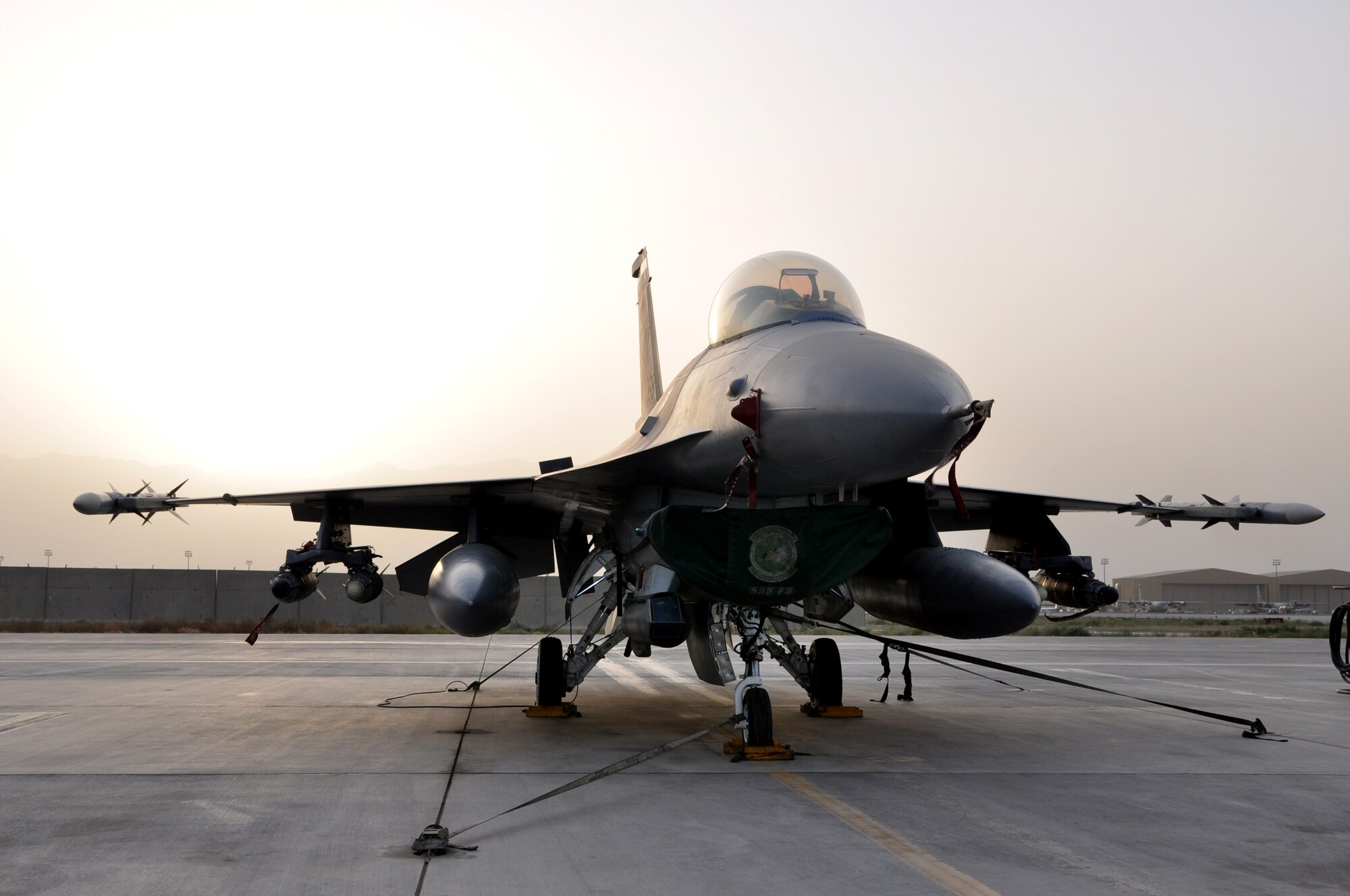 BAGRAM AIRFIELD, Afghanistan – The sun begins to set on the Afghan sky behind an F-16 Fighting Falcon from the 555th Expeditionary Fighter Squadron July 15, 2011. (U.S. Air Force photo/Staff Sgt. John Wright)