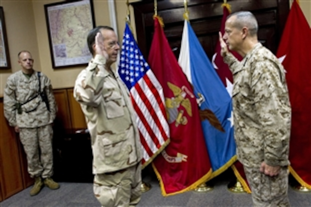 U.S. Navy Adm. Mike Mullen, chairman of the Joint Chiefs of Staff, administers the oath of office to U.S. Marine Corps Gen. John R. Allen at his promotion ceremony at International Security Assistance Force headquarters in Kabul, Afghanistan, July 18, 2011. 
