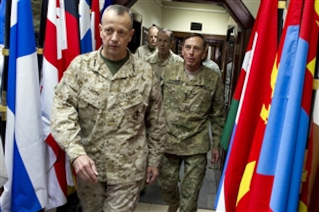U.S. Marine Corps Lt. Gen. John R. Allen, U.S. Army Gen. David H. Petraeus, outgoing commander of the International Security Assistance Force,  and U.S. Navy Adm. Mike Mullen, chairman of the Joint Chiefs of Staff , arrive at ISAF headquarters in Kabul, Afghanistan, for Allen's promotion ceremony, July 18, 2011. Allen is succeeding Petraeus, who has been confirmed as the new CIA director.