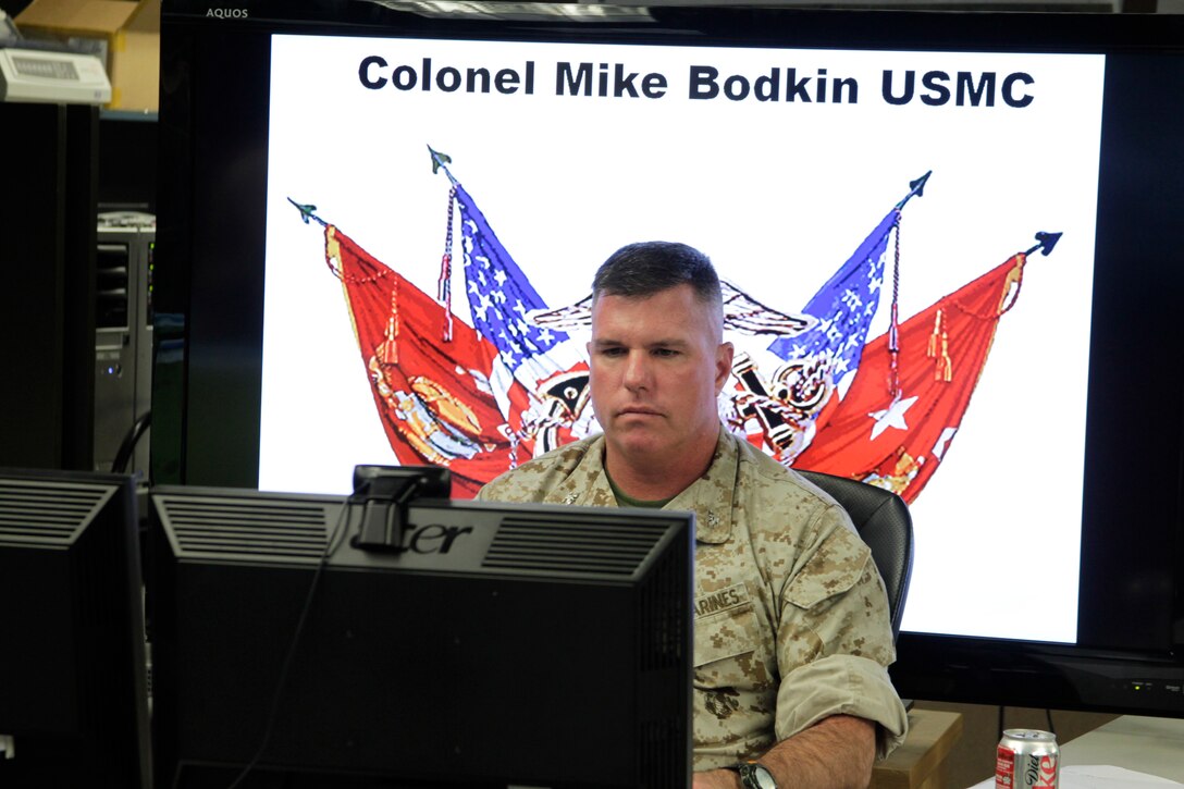 Colonel Mike Bodkin participates in a teleconference with leaders from multiple nations across the globe to test a new network system during the Allied Auroras exercise July 19, 2011.