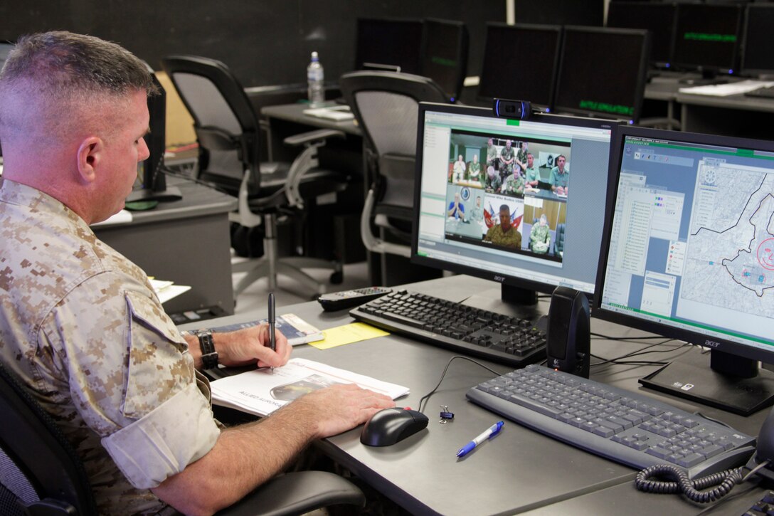 Colonel Mike Bodkin participates in a teleconference with leaders from multiple nations across the globe to test a new network system during the Allied Auroras exercise July 19, 2011.