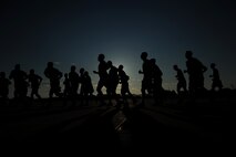KUNSAN AIR BASE, Republic of Korea -- Members of the 8th Fighter Wing participate in the Warrior Run here July 19. The mission of the 8th FW is to defend the base, accept follow-on forces and take the fight north. (U.S. Air Force photo/Staff Sgt. Rasheen A. Douglas)