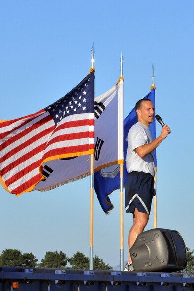 KUNSAN AIR BASE, Republic of Korea -- Col. Scott Pleus, 8th Fighter Wing commander, gives the closing remarks after the Warrior Run here July 19. The Warrior Run was a formation run and a way to boost morale for Airmen and Soldiers. (U.S. Air Force photo/Senior Airman Brittany Y. Bateman