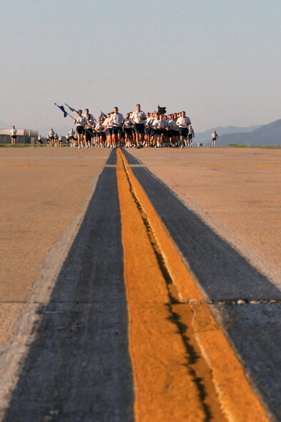 KUNSAN AIR BASE, Republic of Korea -- Members of the 8th Fighter Wing participate in the Warrior Run here July 19. The mission of the 8th FW is to defend the base, accept follow-on forces and take the fight north. (U.S. Air Force photo/Senior Airman Brittany Y. Bateman) 

