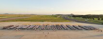 KUNSAN AIR BASE, Republic of Korea -- Members of the 8th Fighter Wing salute during the playing of reveille before participating in the Warrior Run here July 19. The Warrior Run was a formation run and a way to boost morale for Airmen and Soldiers. (U.S. Air Force photo/Senior Airman Brittany Y. Bateman)

