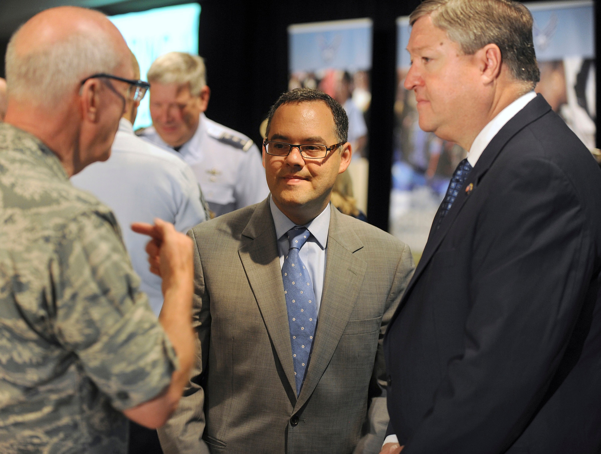 Secretary of the Air Force Michael Donley (right) and Assistant Secretary of the Air Force for Manpower and Reserve Affairs Daniel Ginsberg visit with Maj. Gen. Cecil Richardson, Air Force chief of chaplains, during the Caring for People forum July 19, 2011, in Arlington, Va. Donley made the opening remarks for the three-day event. (U.S. Air Force photo/Scott M. Ash)