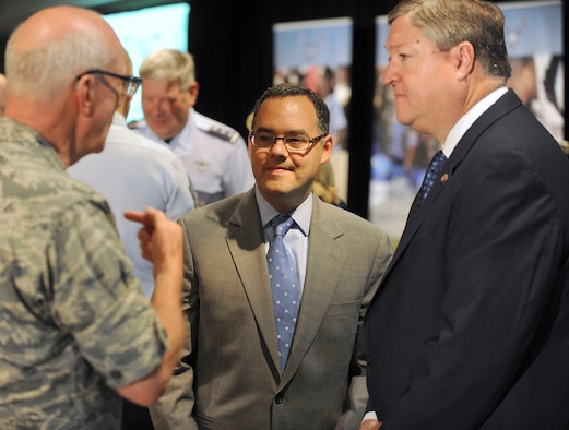 Secretary of the Air Force Michael Donley (right) and Assistant Secretary of the Air Force for Manpower and Reserve Affairs Daniel Ginsberg visit with Maj. Gen. Cecil Richardson, Air Force chief of chaplains, during the Caring for People forum July 19, 2011, in Arlington, Va. Donley made the opening remarks for the three-day event. (U.S. Air Force photo/Scott M. Ash)