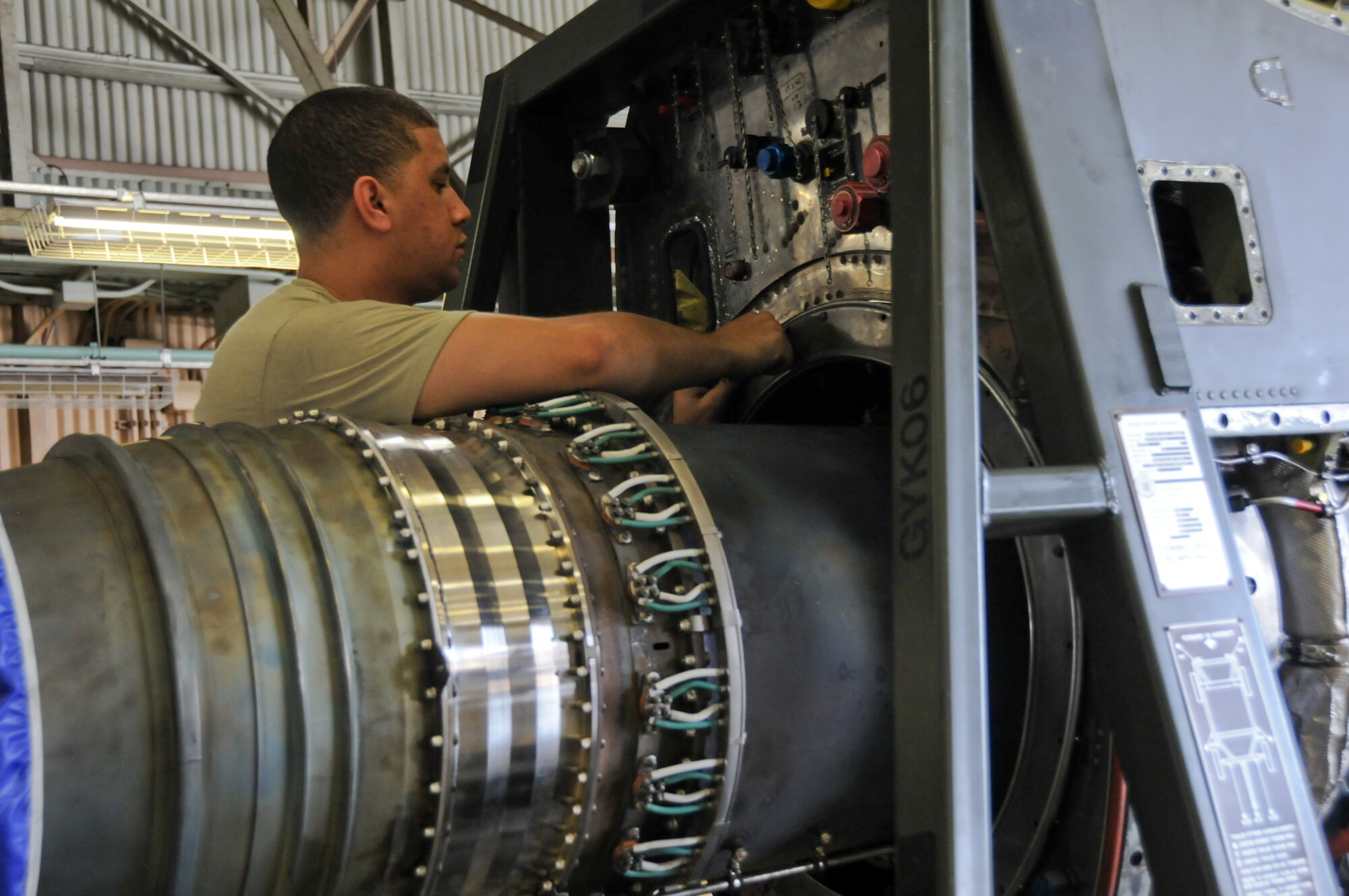 YOKOTA AIR BASE, Japan -- An Airman from the 374th Maintenance Squadron Propulsion Flight, performs maintenance work on a T-56- 15 engine at Yokota Air Base, Japan, July 14, 2011. Minor engine problems are fixed on the flight line, but major cases such as foreign object damage or internal components damage are fixed at the engine shop. (U.S. Air Force photo/Airman 1st Class Krystal M. Garrett) 