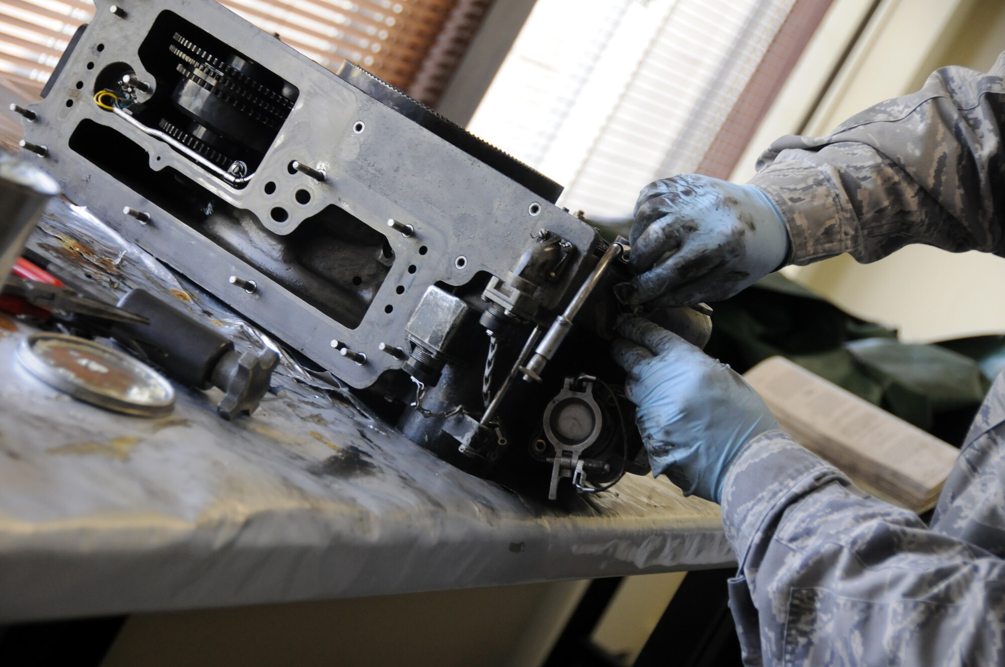 YOKOTA AIR BASE, Japan -- Tech Sgt. Paul Pearson, 374th Maintenance Squadron propulsion flight aerospace propulsion craftsman, reassembles a pump housing destined for a repair facility at Yokota Air Base, Japan, July 14, 2011. Sergeant Parson works with approximately 30 other aerospace propulsion technicians to maintain C-130 Hercules airframes at Yokota and help keep them mission ready. (U.S. Air Force photo/Airman 1st Class Krystal M. Garrett) 