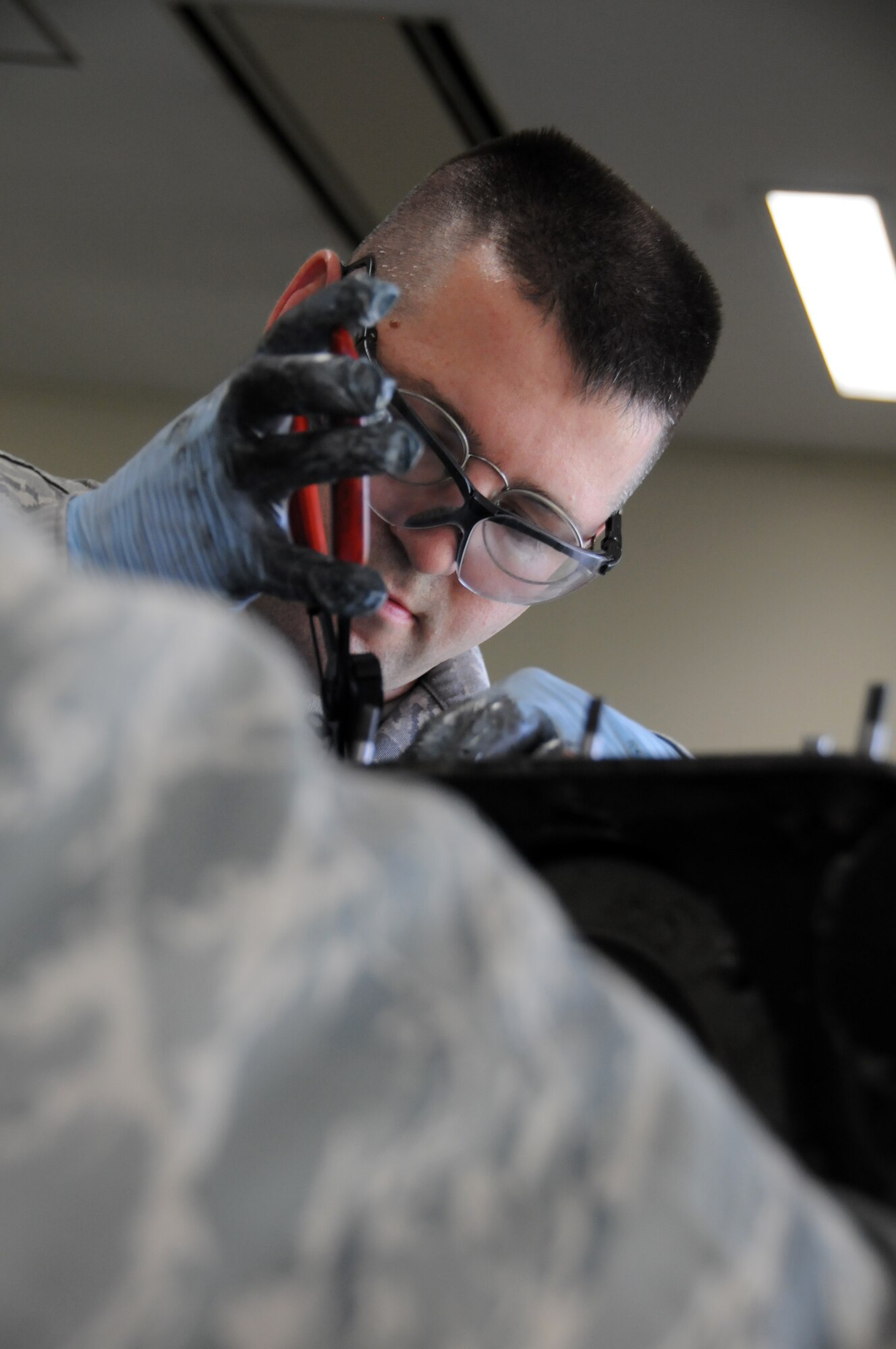 YOKOTA AIR BASE, Japan -- Tech Sgt. Paul Pearson, 374th Maintenance Squadron propulsion flight aerospace propulsion craftsman, reassembles a pump housing destined for a repair facility at Yokota Air Base, Japan, July 14, 2011. If parts become unusable, they are sent to the depot, and once fixed they are sent back into the Air Force supply system. (U.S. Air Force photo/Airman 1st Class Krystal M. Garrett)