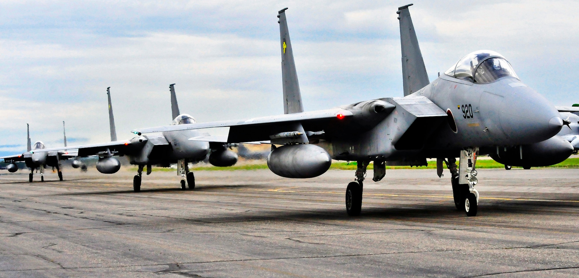 Several Japanese F-15 Eagle fighter aircraft taxi out July 15, 2011, Eielson Air Force Base, Alaska.  Thorough planning and precautions have ensured challenges were overcome and the immediate participation of six of Japan's F-15s upon arrival at RF-A 11-2. (U.S. Air Force photo by/Staff Sgt. Miguel Lara)