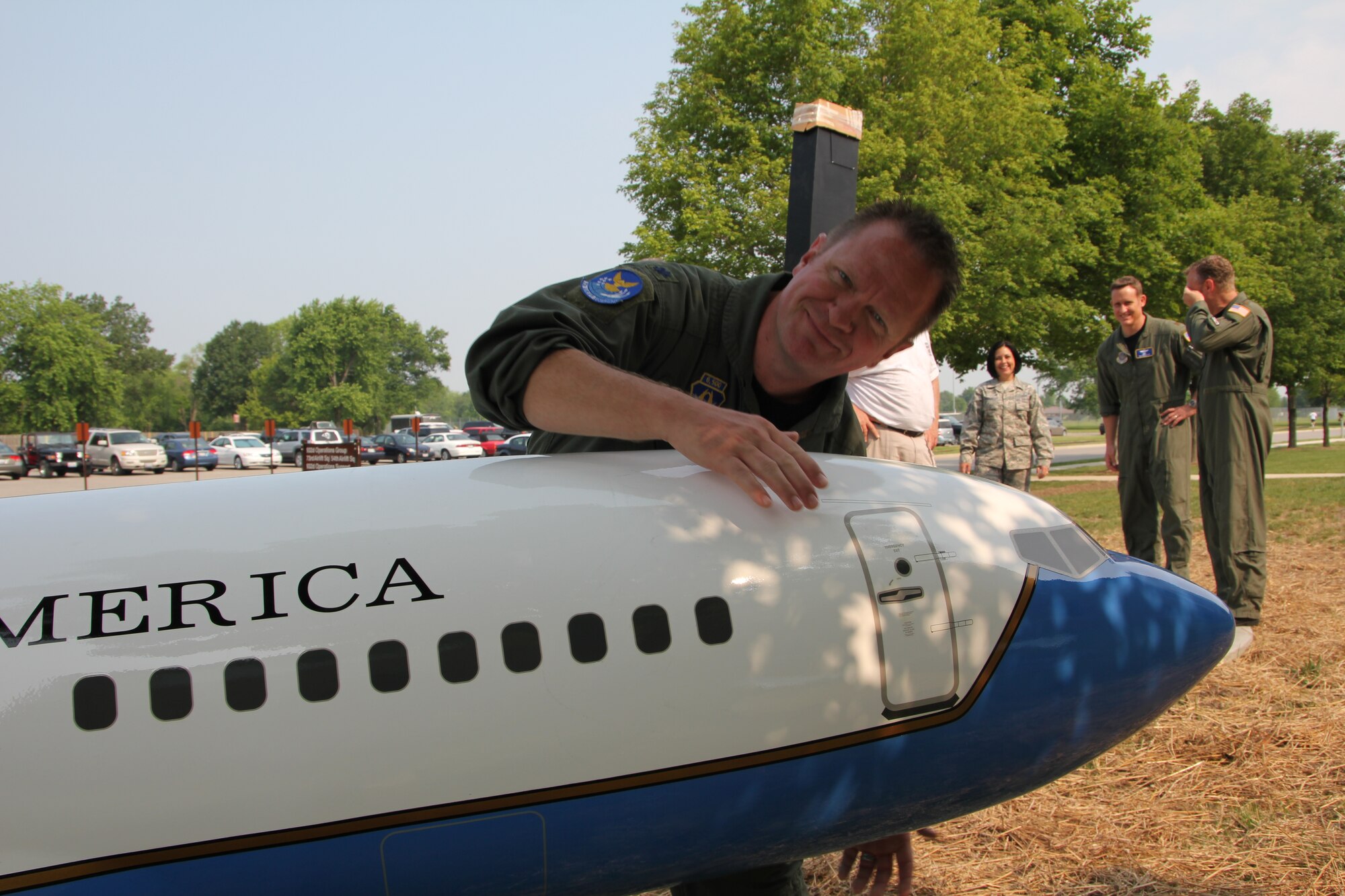 Lt. Col. Rob Witzel was never happier than the day the 932nd Airlift Wing's new  C-40C model was  resting on its perch infront of the 932nd Operations  Group building.  The model has a wing span of 16 feet by 15 feet long and weighs 250 pounds.  Witzel said the project took more than a year to design, prepare bids and construct. Two smaller models are displayed indoors.  The 932nd Airlift Wing flies the C-40C and C-9C aircraft. (U.S. Air Force photo/Maj. Stan Paregien)
