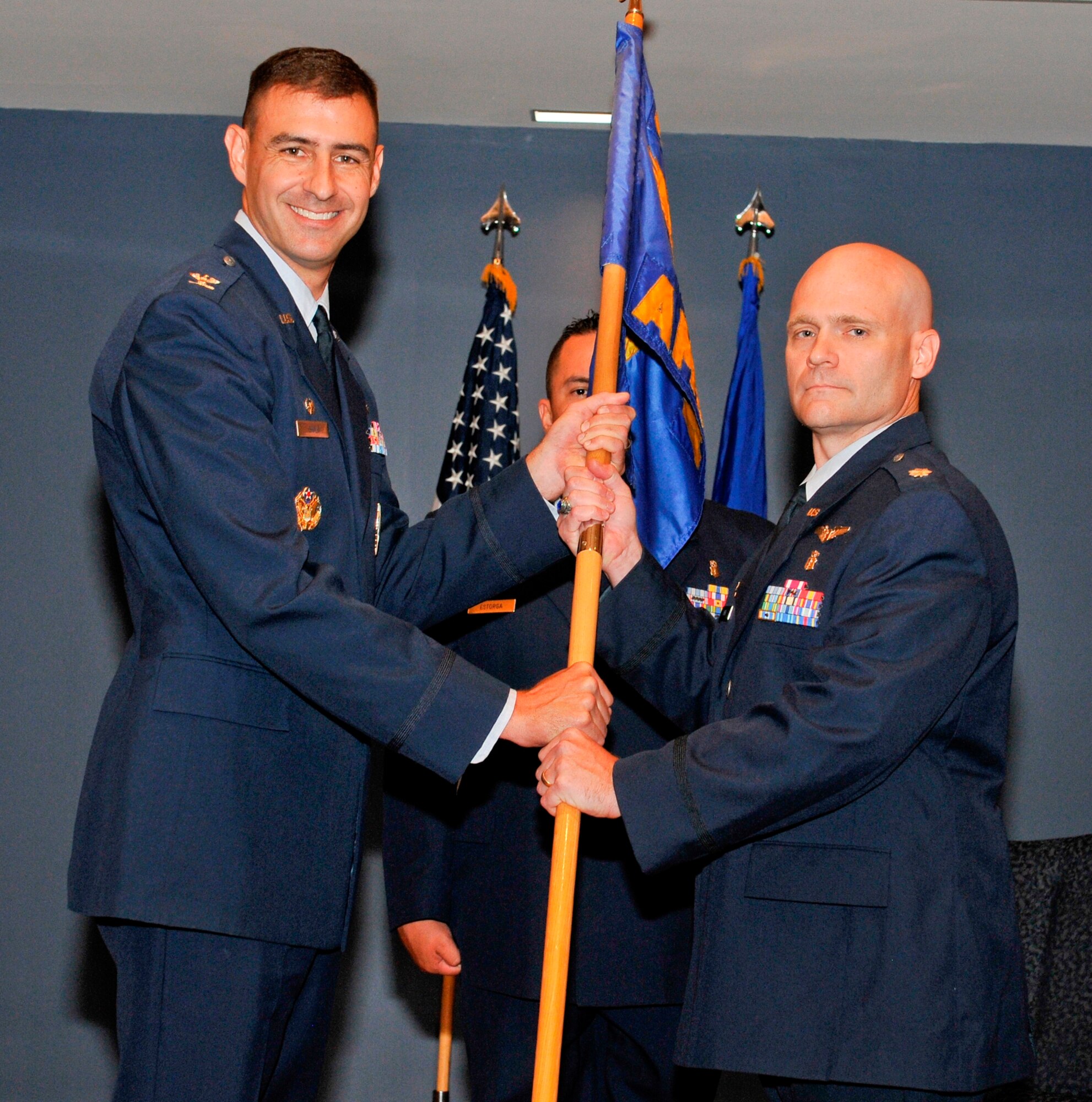 Col. Paul Skala, 325th Medical Group commander, passes command of the 325th Aerospace Medicine Squadron to Lt. Col. (Dr.) Robert York during a change of command ceremony July 19. Colonel York replaces Lt. Col. (Dr.) Erik Koda who departs Tyndall to serve as commander of the 48th Aerospace Medicine Squadron, Lakenheath Air Base, United Kingdom. Colonel York arrives from the 51st Aerospace Medicine Squadron, Osan Air Base, Republic of Korea. (U.S. Air Force photo by Lisa Norman)