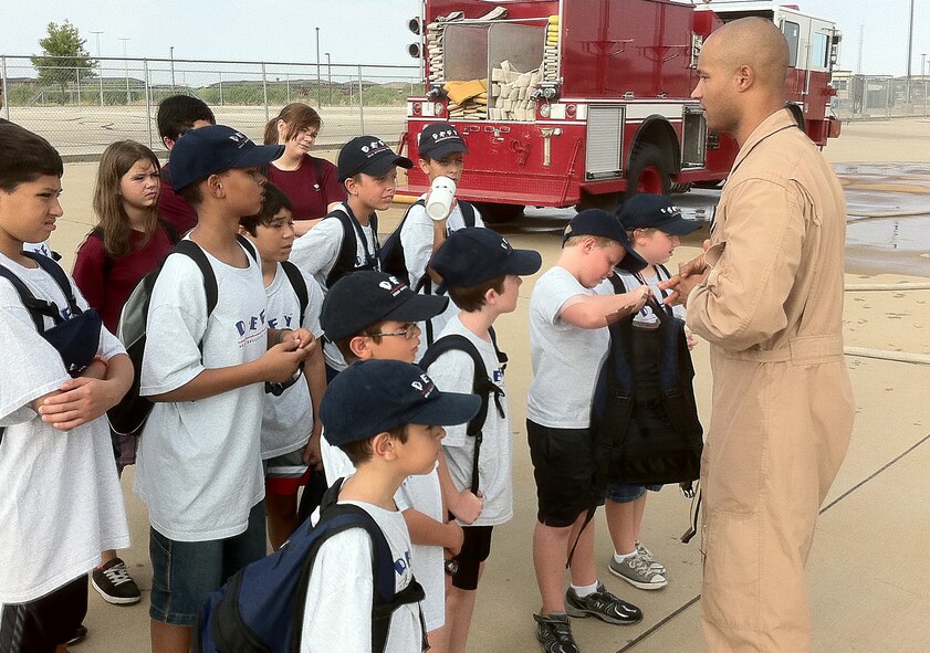 GOODFELLOW AIR FORCE BASE, Texas -- Navy Petty Officer 2nd Class Isaac Berick, 312th Training Squadron Instructor, gives DEFY Camp participants a tour of the Louis F. Garland Fire Academy here July 19 as part of the camp's activities.  More than a dozen youth ages 9-12 signed up for this year's event which focuses on keeping youth drug free.  They are scheduled to graduate from the two-week long event July 20.  (Courtesy photo/Navy Petty Officer 2nd Class Dennis Delarama)