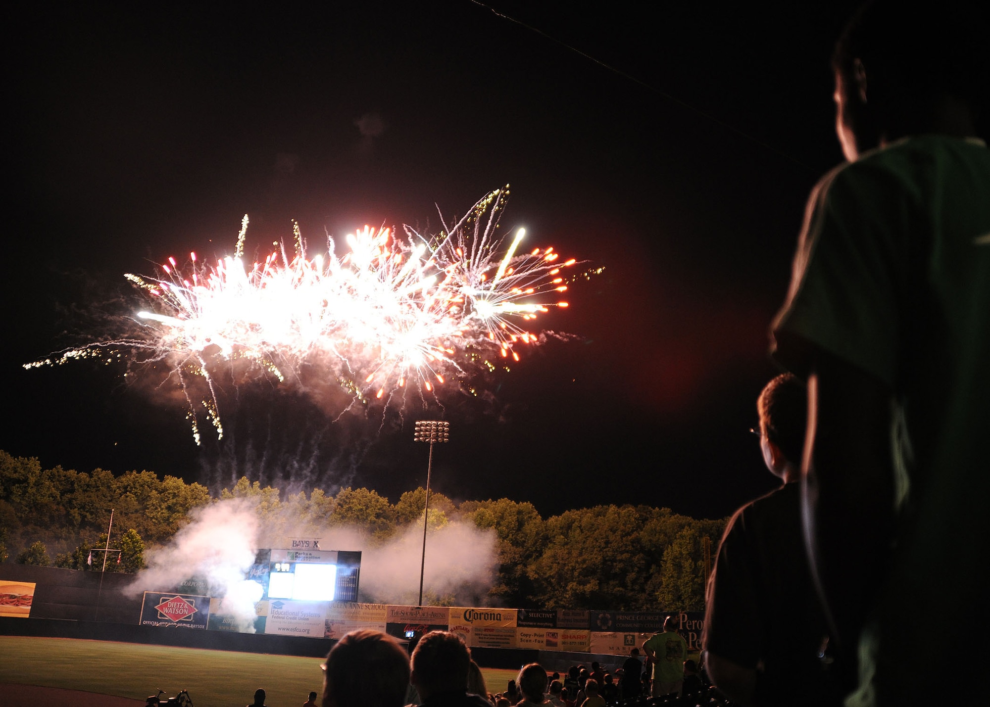 Attendees at the Andrews Night at the Bowie Baysox game enjoy fireworks afterward at the Prince George's Stadium July 15. The Bowie Baysox hosted Joint Base Andrews night at their sporting event to show their appreciation for the military community.( U.S. Air Force photo/ Senior Airman Matt Coleman-Foster)
