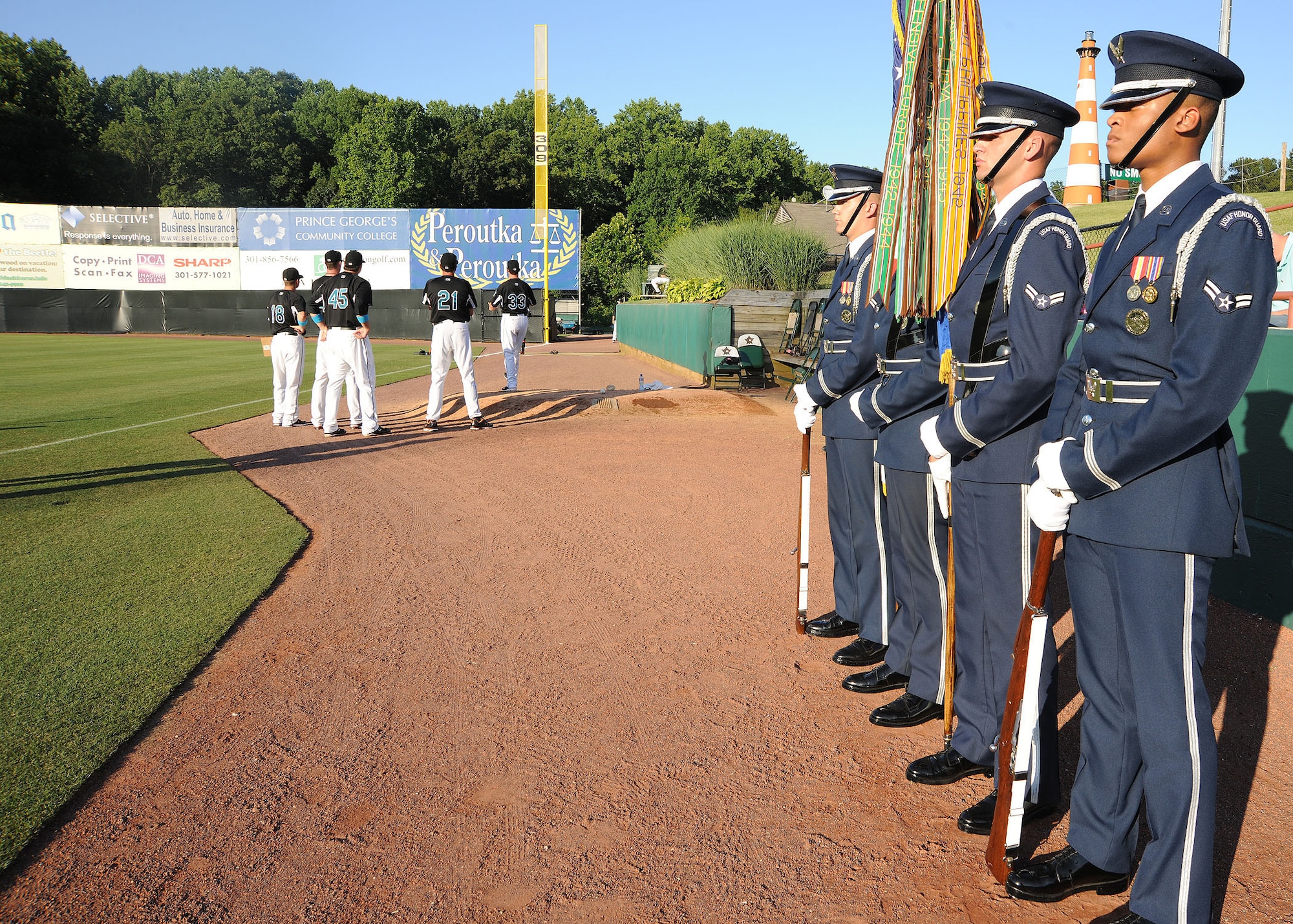 A United States Air Force Honor Guard color guard team prepares to present the Colors for the beginning of the Bowie Baysoxs baseball game against the Richmond Flying Squirrels at the Prince George's Stadium July 15. The Bowie Baysoxs hosted Joint Base Andrews night at their sporting event to show their appreciation for the military community.( U.S. Air Force photo/ Senior Airman Matt Coleman-Foster)