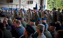 Members of a 23rd Wing formation stand at parade rest while audience members talk among themselves before the start of the 23rd WG change of command ceremony at Moody Air Force Base, Ga., July 19, 2011. The formation was made up of representatives from all groups and detachments that make up the wing. (U.S. Air Force photo by Staff Sgt. Jamal D. Sutter/Released)