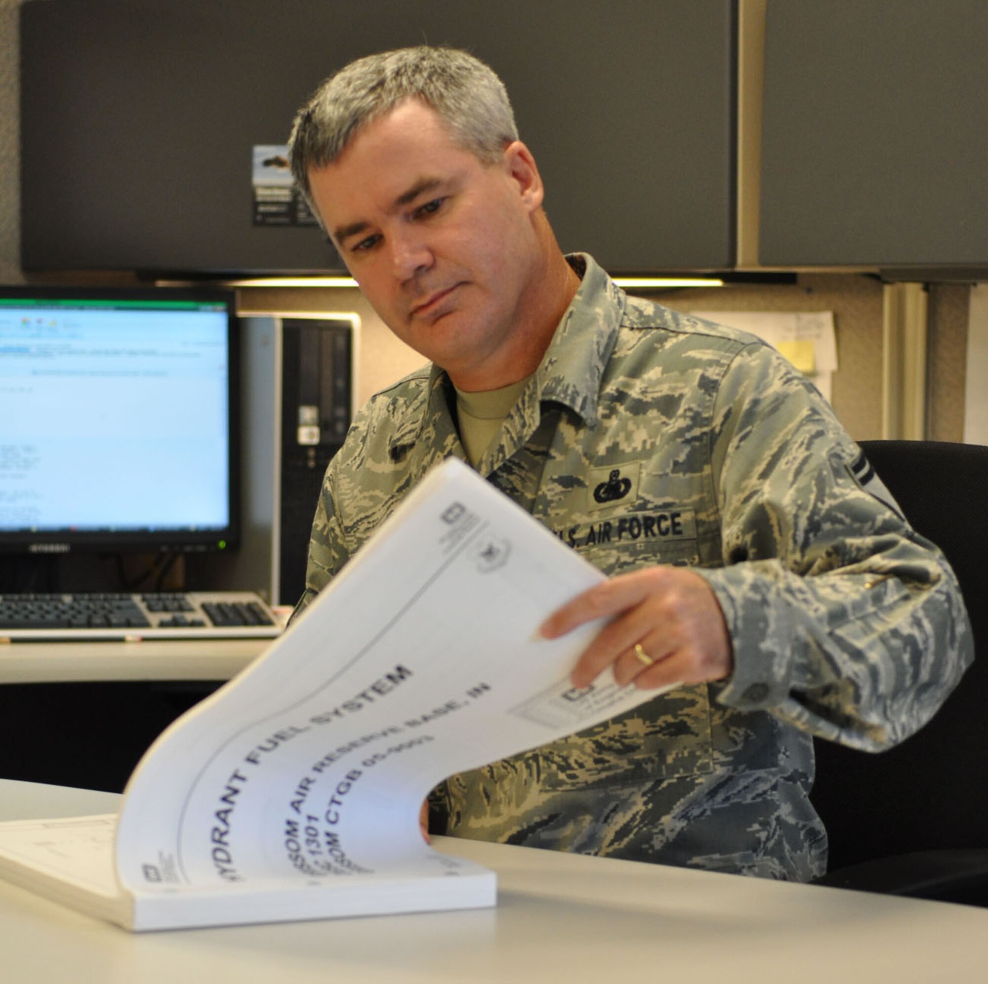 Senior Master Sgt. Steven C. George looks over the Hydrant Fuels System plan for Grissom Air Reserve Base, Ind., July 19, 2011. The command fuels operations manager for Air Force Reserve Command was named the AFRC Senior NCO of the Year. (U.S. Air Force photo/Chief Master Sgt. Bill Goben)