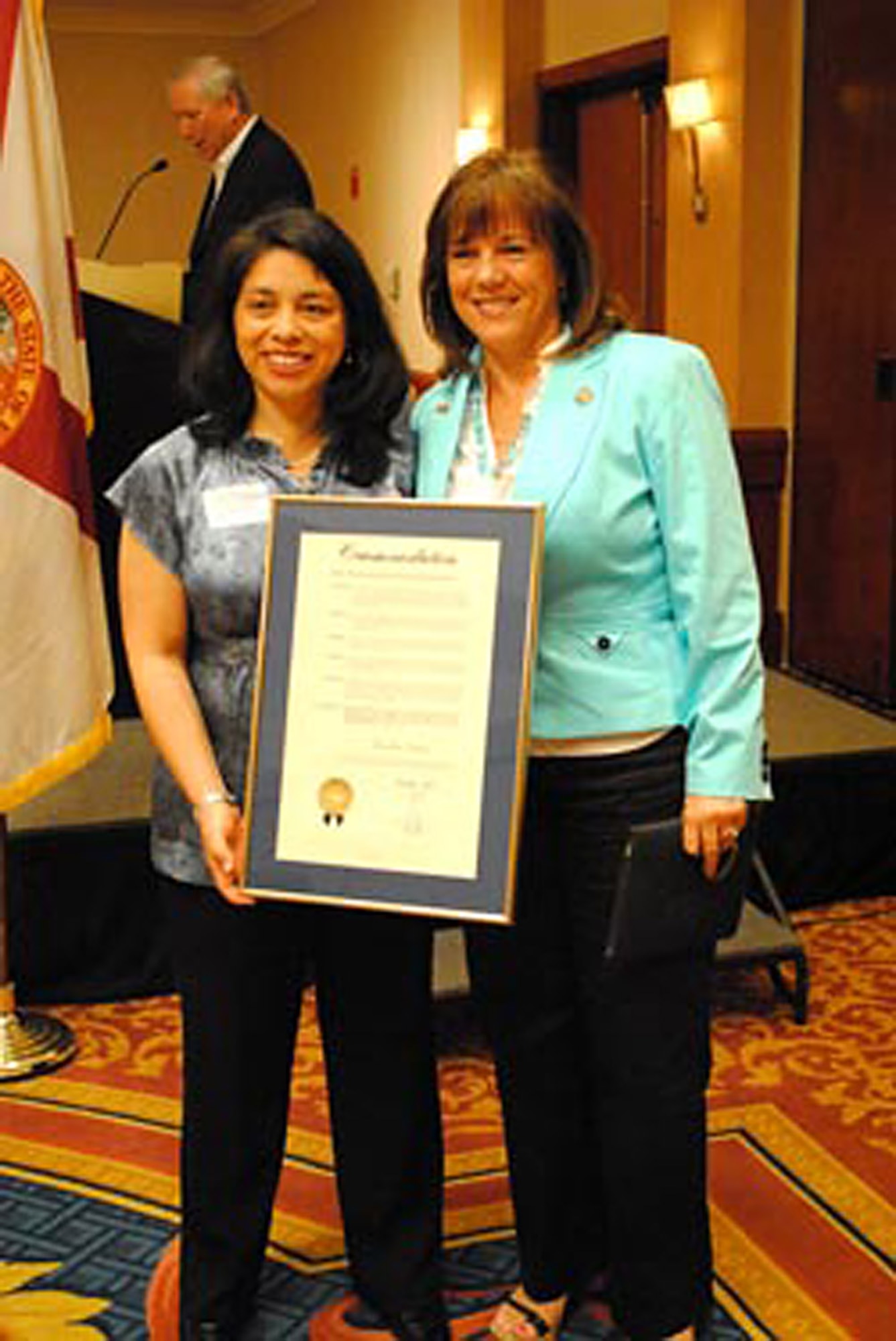 Mrs. Jesika Davis receives a Miami-Dade County Commendation from Commissioner Lynda Bell.