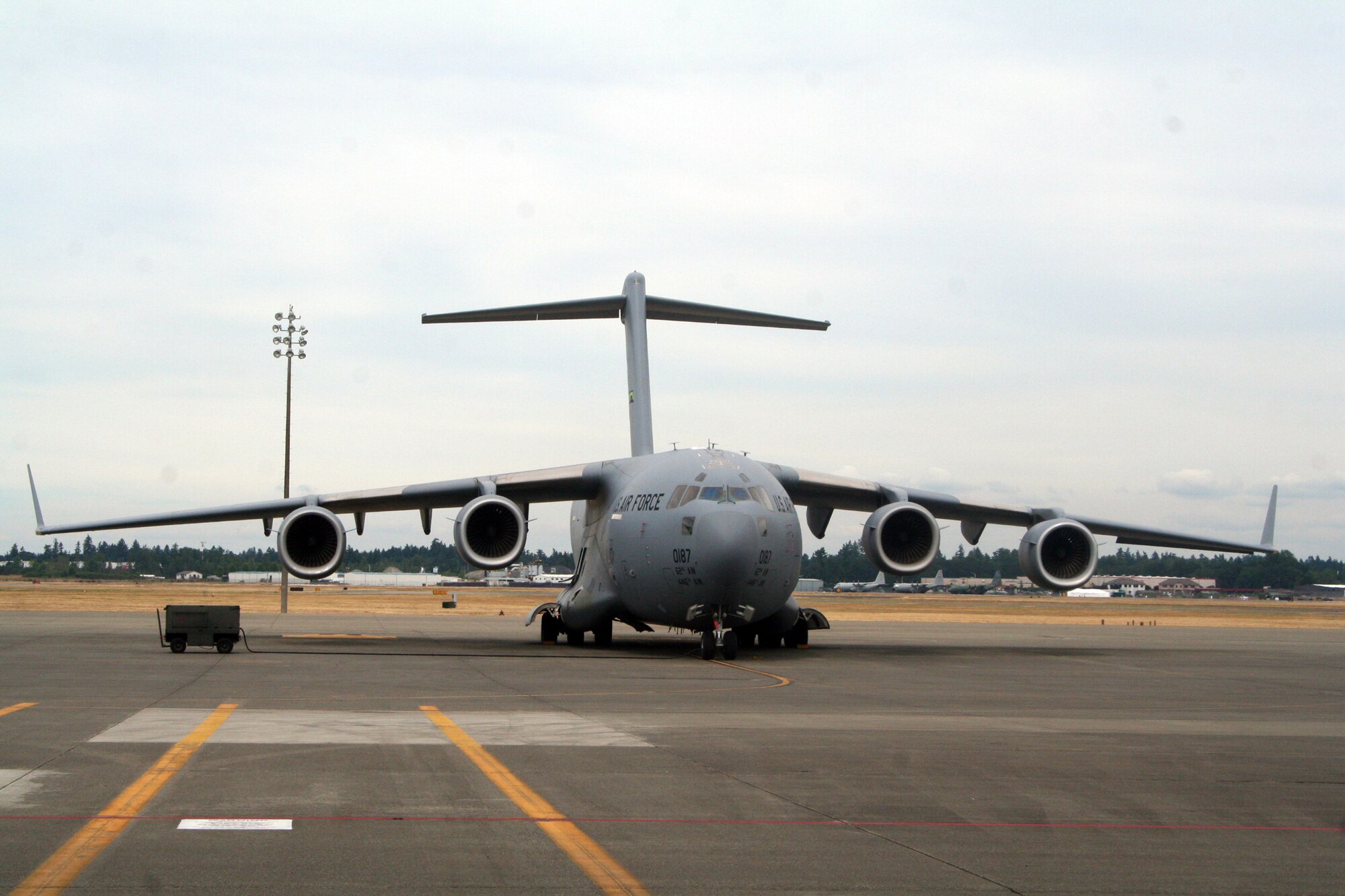 A C-17 Globemaster III from the 62nd Airlift Wing at Joint Base Lewis-McChord, Wash., is parked on the flightline at the base on July 18, 2011. The C-17 is one of the aircraft that will be used for Air Mobility Rodeo 2011. Rodeo, sponsored by the Air Mobility Command, is the Mobility Air Force's (MAF) readiness competition. This competition focuses on improving our worldwide air mobility forces' professional core abilities. Air Mobility 2011 will be held at McChord Field, Wash., July 24-29, 2011. More than 150 teams and 3,000 people from the Air Force, and Air Force Reserve, as well as allied nations, are expected to participate. (U.S. Air Force Photo/Master Sgt. Scott T. Sturkol)