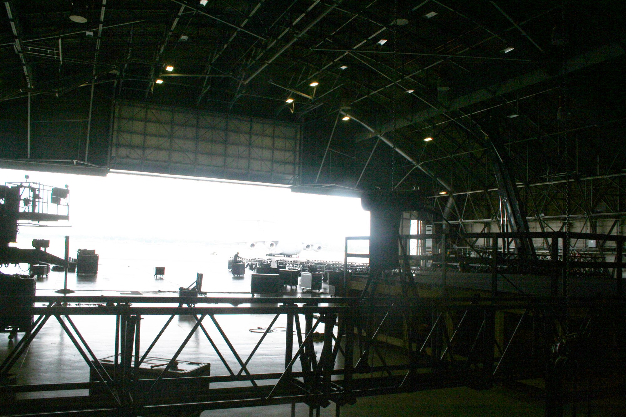 A stage and other equipment is prepared inside an aircraft hangar at Joint Base Lewis-McChord, Wash., on July 18, 2011, for Air Mobility Rodeo 2011. Rodeo, sponsored by the Air Mobility Command, is the Mobility Air Force's (MAF) readiness competition. This competition focuses on improving our worldwide air mobility forces' professional core abilities. Air Mobility 2011 will be held at McChord Field, Wash., July 24-29, 2011. More than 150 teams and 3,000 people from the Air Force, and Air Force Reserve, as well as allied nations, are expected to participate. (U.S. Air Force Photo/Master Sgt. Scott Sturkol)