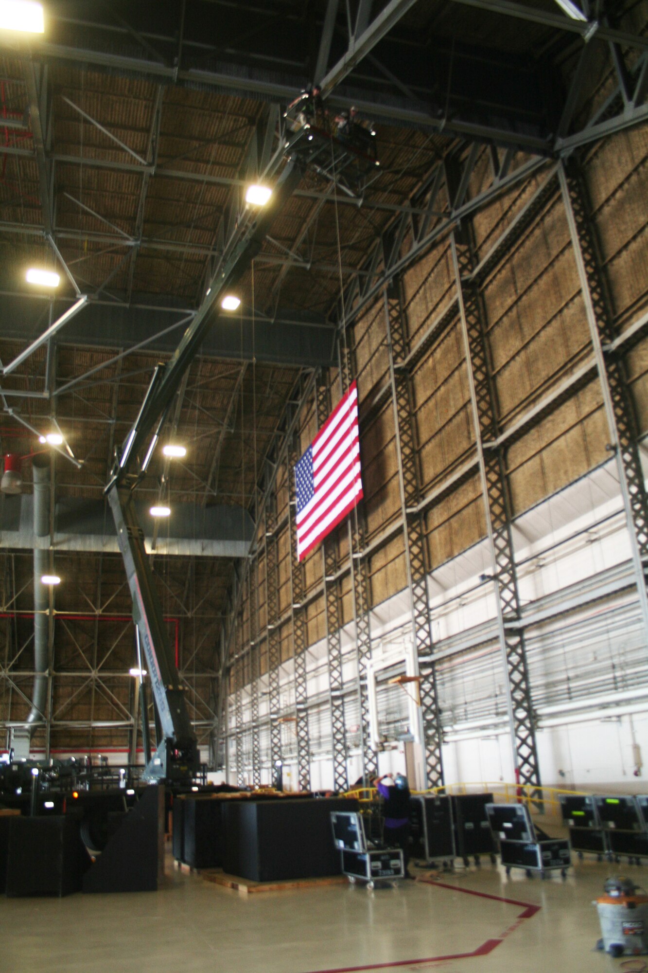 A stage and other equipment is prepared inside an aircraft hangar at Joint Base Lewis-McChord, Wash., on July 17, 2011, for Air Mobility Rodeo 2011. Rodeo, sponsored by the Air Mobility Command, is the Mobility Air Force's (MAF) readiness competition. This competition focuses on improving our worldwide air mobility forces' professional core abilities. Air Mobility 2011 will be held at McChord Field, Wash., July 24-29, 2011. More than 150 teams and 3,000 people from the Air Force, and Air Force Reserve, as well as allied nations, are expected to participate. (U.S. Air Force Photo/Master Sgt. Scott Sturkol)