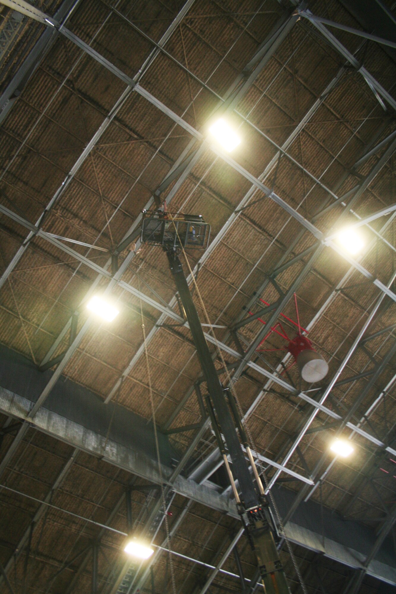 A stage and other equipment is prepared inside an aircraft hangar at Joint Base Lewis-McChord, Wash., on July 17, 2011, for Air Mobility Rodeo 2011. Rodeo, sponsored by the Air Mobility Command, is the Mobility Air Force's (MAF) readiness competition. This competition focuses on improving our worldwide air mobility forces' professional core abilities. Air Mobility 2011 will be held at McChord Field, Wash., July 24-29, 2011. More than 150 teams and 3,000 people from the Air Force, and Air Force Reserve, as well as allied nations, are expected to participate. (U.S. Air Force Photo/Master Sgt. Scott Sturkol)