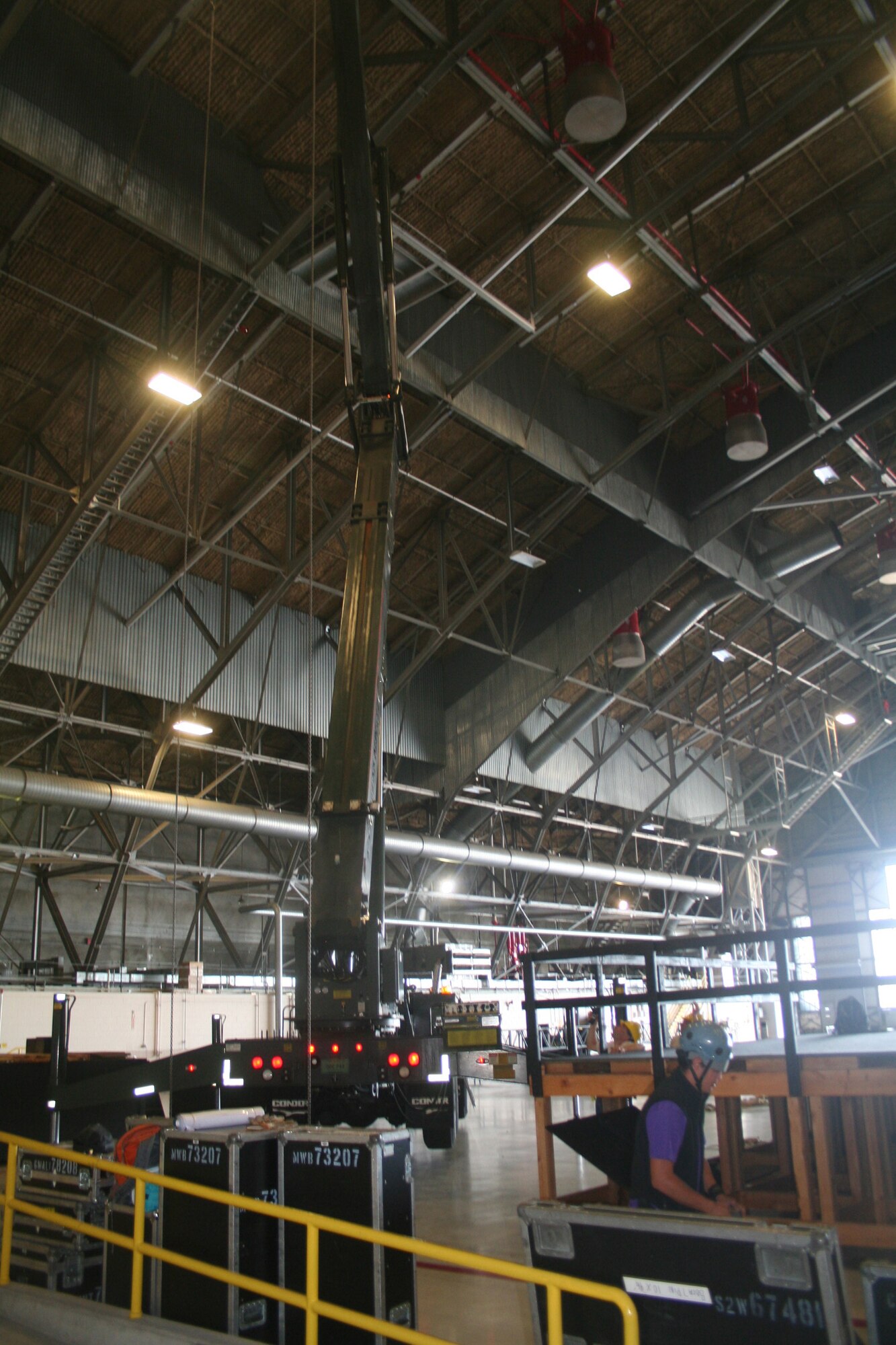 A stage and other equipment is prepared inside an aircraft hangar at Joint Base Lewis-McChord, Wash., on July 17, 2011, for Air Mobility Rodeo 2011. Rodeo, sponsored by the Air Mobility Command, is the Mobility Air Force's (MAF) readiness competition. This competition focuses on improving our worldwide air mobility forces' professional core abilities. Air Mobility 2011 will be held at McChord Field, Wash., July 24-29, 2011. More than 150 teams and 3,000 people from the Air Force, and Air Force Reserve, as well as allied nations, are expected to participate. (U.S. Air Force Photo/Master Sgt. Scott Sturkol)
