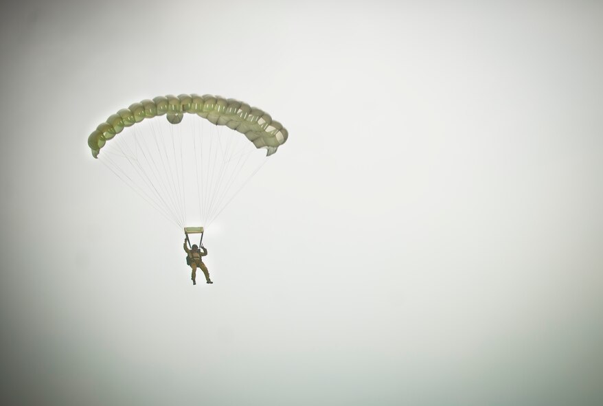 Master Sgt. Robert Disney, 347th Rescue Group standards and evaluations superintendent, parachutes down from the sky during a free fall jump from an HC-130P Combat King at Moody Air Force Base, Ga., July 12, 2011. The 38th Rescue Squadron used this event to train and stay current on monthly requirements. (U.S. Air Force photo by Airman 1st Class Joshua Green/Released)
